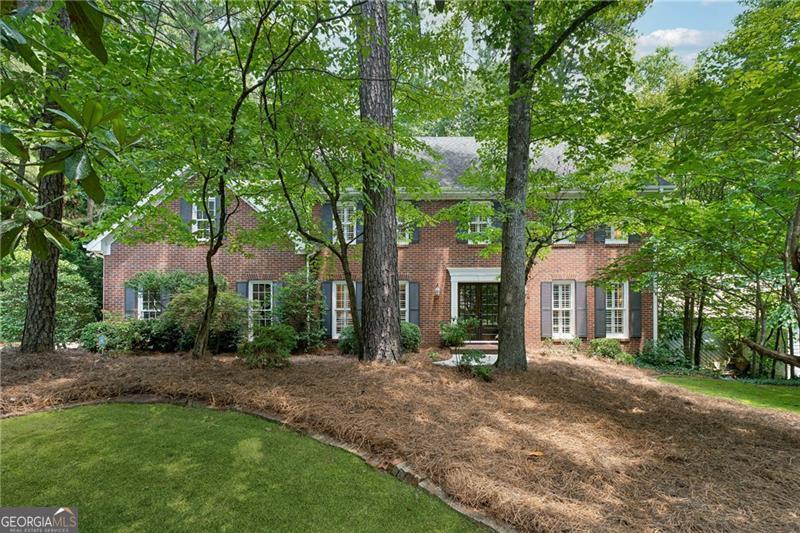 Welcome to 904 Willeo Place, a rare opportunity in River Forest! This well-maintained one-owner home is tucked away on a quiet cul-de-sac in East Cobb's highly sought-after Timber Ridge Elementary, Dickerson Middle and Walton High School district. Enjoy the peace and privacy of a wooded backyard that backs to a creek, creating your own natural oasis right in the heart of Marietta. Gorgeous double front doors lead into a foyer flanked by formal living and dining rooms. A fireside family room is spacious yet cozy, and hardwood floors are throughout the main floor. The kitchen is perfect for gathering, cooking, and entertaining, featuring an island, breakfast bar, wall oven and microwave, electric cooktop, built-ins, pantry and breakfast room. You'll love the vaulted screen porch and deck for sipping your coffee and listening to the sounds of nature. Upstairs is the primary suite with walk-in closet, dual vanities, soaking tub and tiled shower. Three bedrooms share a hall bath. A second master suite was created from the bonus room and includes a TV/sitting room and a full bath. The finished basement offers flexible living space for a media/rec room or gym, plus a dedicated workshop and extra storage for all your projects and hobbies. Located in the welcoming River Forest swim/tennis community, this home is just minutes from Canton Street in Roswell, the Avenues of East Cobb, and all the top-rated schools and amenities East Cobb has to offer. Don't miss it!