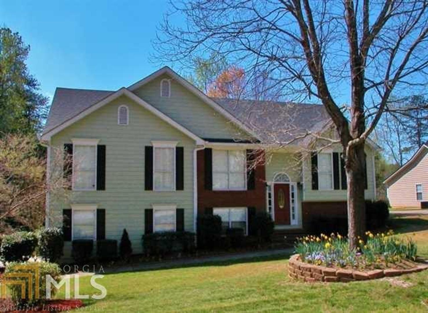 Beautifully maintained home! This home is much larger than it looks. It features gorgeous tile and granite in master bathroom, large sunroom, private fenced back yard, huge bonus room in lower basement area, and very open floor plan!