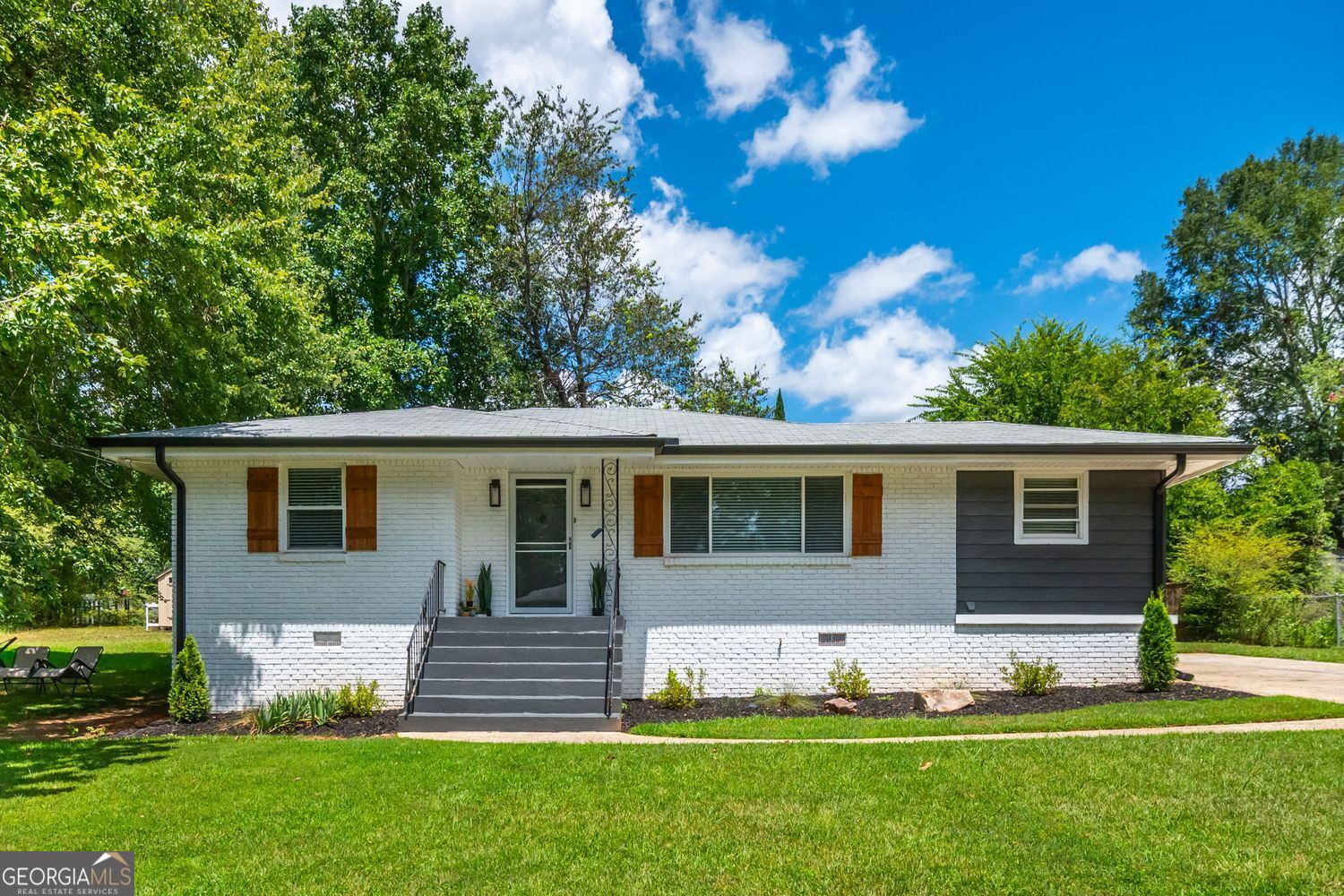 Welcome to 941 Shirley Street-a charming three-bedroom, one-bathroom brick ranch in the heart of Smyrna, freshly painted inside and out. Gleaming hardwood floors flow through the living spaces, creating a warm and inviting feel. Outside, the large fenced lot provides plenty of room to gather, garden, or relax in your own private retreat. The detached garage offers endless potential-convert it into a man cave, she shed, workshop, or use it for extra parking. This home's location is unbeatable for professionals, first-time buyers, starter families, or investors alike. It's situated in the top-rated King Springs Elementary School district and is minutes from major highways, making commutes to Atlanta and beyond a breeze. Enjoy easy access to the vibrant Smyrna Market Village, Truist Park, and local parks, as well as the Silver Comet Trail for biking and walking adventures. With its incredible location, flexible spaces, and classic charm, 941 Shirley Street is a fantastic opportunity for a cozy home or a lucrative rental in one of Smyrna's most desirable neighborhoods.