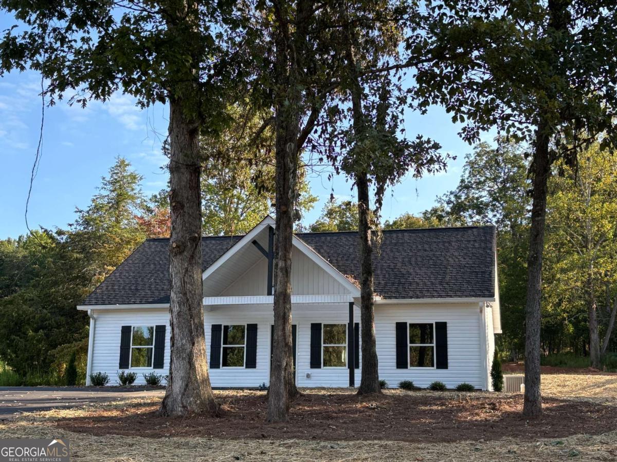 MUCH SOUGHT AFTER QUALITY NEW CONSTRUCTION, 3/2 VINYL RANCH WITH OPEN FLOOR PLAN, GRANITE THRU OUT, LUXURY VINYL FLOORING, GE STAINLESS APPLIANCES INCLUDING SIDE BY SIDE REFRIGERATOR AND BUILT IN MICROWAVE, FARMHOUSE SINK, LAUNDRY ROOM OFF KITCHEN, SPLIT BEDROOM PLAN WITH TREY CEILING, WALK-IN CLOSET, DOUBLE VANITY. NO RENT RESTRICTIONS, PAVED DRIVE ON PAVED COUNTY ROAD, TOTAL ELECTRIC, $45 MONTH FOR WATER, TERMITE BOND AND BUILDER'S WARRANTY A PLUS! PROPERTY WAS SUBDIVIDED THIS YEAR AND LUMPKIN COUNTY TAX COMMISSIONER OFFICE CAN GIVE ESTIMATE OF TAXES FOR CURRENT YEAR.