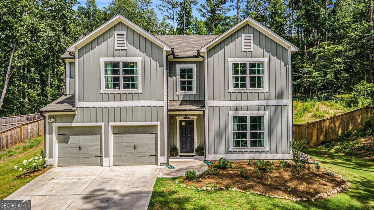 Perfectly situated on 2 ACRES, this beautifully maintained home offers a rare blend of privacy, character, and versatile living space, all within convenient proximity to everyday amenities. A long driveway with an extended parking pad ensures ample parking, while the board and batten exterior adds timeless charm and curb appeal. Step inside to discover a thoughtfully designed open-concept floor plan that flows effortlessly from room to room, enhanced by high ceilings and abundant natural light. The spacious living area serves as the heart of the home, offering warmth and comfort in a bright and airy setting. The kitchen is a standout, equipped with stainless steel appliances, a large center island, and a beautiful herringbone tile backsplash. A walk-in pantry adds function and flexibility, featuring a butcher block countertop with electrical outlets, ideal for keeping small appliances tucked neatly away yet easily accessible. The main floor includes two generously sized bedrooms, including a luxurious primary suite complete with a double vanity, a huge walk-in tiled shower, linen closet, water closet, creating your own retreat for rest and relaxation. The secondary bedroom on this level can be used as a guest suite, home office, or playroom, depending on your needs. Upstairs, a cozy landing leads to two additional large bedrooms. One of these is exceptionally spacious, currently used as a playroom and recreational area featuring a rock wall and ceiling hook for a hanging chair. Whether used as a hobby space, entertainment zone, or converted into additional bedrooms, the versatility of this space makes it a true highlight. Outside, enjoy your fully fenced and private backyard offering endless opportunities to create your dream outdoor space. Unwind on the patio under the SunSetter awning, or gather around the fire pit with the cooler months ahead. Whether you're gardening, entertaining, or enjoying a quiet evening under the stars, the wooded views creates a picturesque backdrop. This exceptional home combines modern comfort, natural beauty, and flexible living in one package.