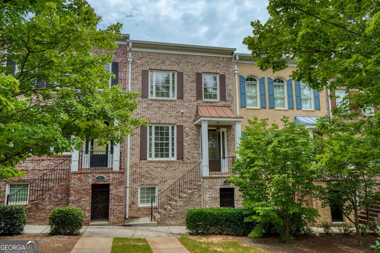 Exceptional Townhome with ELEVATOR in Prime Dunwoody Location - Under $600K! Welcome to Dunwoody Row, a sought-after gated community ideally situated near the heart of Dunwoody. This rare and remarkable townhome stands out as one of the few in the neighborhood featuring a private elevator-an incredible convenience at this price point. Step inside to a freshly painted interior, where the bright and airy foyer flows seamlessly into the formal dining room, showcasing an abundance of natural light and an open, inviting layout. The spacious main living area includes custom built-in bookcases and a desk, a cozy gas fireplace, and a seamless connection to the kitchen-perfect for entertaining. A walk-in pantry, half bath, and elevator access complete the main level. Upstairs, you'll find two generously sized bedrooms, including a secondary suite with a full bath and ample closet space. The expansive primary suite is a true retreat, offering a separate sitting area, two walk-in closets, and bathroom with dual vanities, a whirlpool tub, walk-in shower, water closet, and large windows that fill the space with natural light. A full laundry room with built-in cabinetry is also located upstairs for added convenience. The finished terrace level offers a versatile flex space with durable LVP flooring, an additional half bath, and access to the spacious two-car garage. Enjoy plentiful guest parking and proximity to premier shopping, dining, and business centers. This move-in ready home combines luxury, functionality, and location-schedule your private showing today! *Note - Virtual staging has been completed on this home.