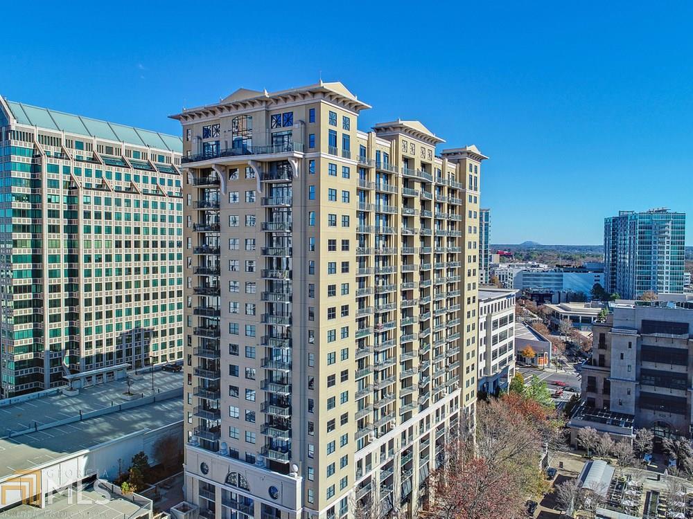 Enjoy luxury condo living with stunning views in this prime Buckhead location across from The Shops of Buckhead. The open floor plan treats you to a sun-filled family room with access to the private balcony and an open view to the eat-in kitchen that features a breakfast bar island, granite counters, stainless steel appliances and a spacious dining area. The generously sized bedroom boasts access to the balcony, a private bathroom with separate shower and soaking tub and a huge walk-in closet. To complete the unit is an in-unit washer and dryer. This full amenity building offers a saltwater pool, sundeck, sauna, barbecue/grilling area, club room, theater, state-of-the-art fitness facility, conference room, meeting area, and 24/7 concierge! Enjoy the convenience of being just moments to excellent restaurants, shopping, Whole Foods, Trader Joe's and more. Assigned parking is included.