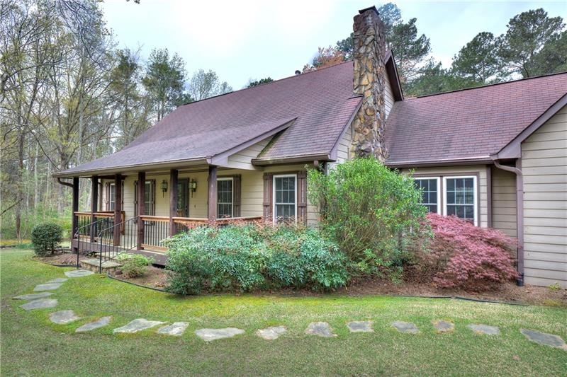 Charming Home, Perfect Location! This 3 BR / 2.5 BA is set back & secluded nicely off the street for privacy. This solidly constructed home features a great room / dining area with a stone-front fireplace, T&G (tongue & groove) pine floors, and access to the expansive deck. With a master on the main, generous walk-in closet, and bath w/ tile floors and tub/shower surround. Kitchen includes all appliances, refrigerator, electric range, microwave, and a trash compactor, too! Also, with hardwood floors and a good-sized breakfast area. Just off the kitchen, is the laundry room, hidden back stairs to the upper bonus room, and entry into the 2-car garage. Venture upstairs from the great room, up to 2 large bedrooms, the hall bath, and a finished bonus room… perfect for your game or media room! Heading downstairs to the unfinished basement, there’s plenty of room for storage and your workshop, with easy access to the backyard through the boat door. You’ll enjoy all the beautiful landscaping and blooms from countless flowering shrubs and plants. The large rear deck overlooks the very private and level rear yard. All of this on a 2 acre lot, in an area rich in local history of years past, and you’ll be located in a prime location, that is close to shopping, restaurants, excellent schools and parks! … And only 3 miles to Kennesaw Mountain for your hiking outings on the Mountain.