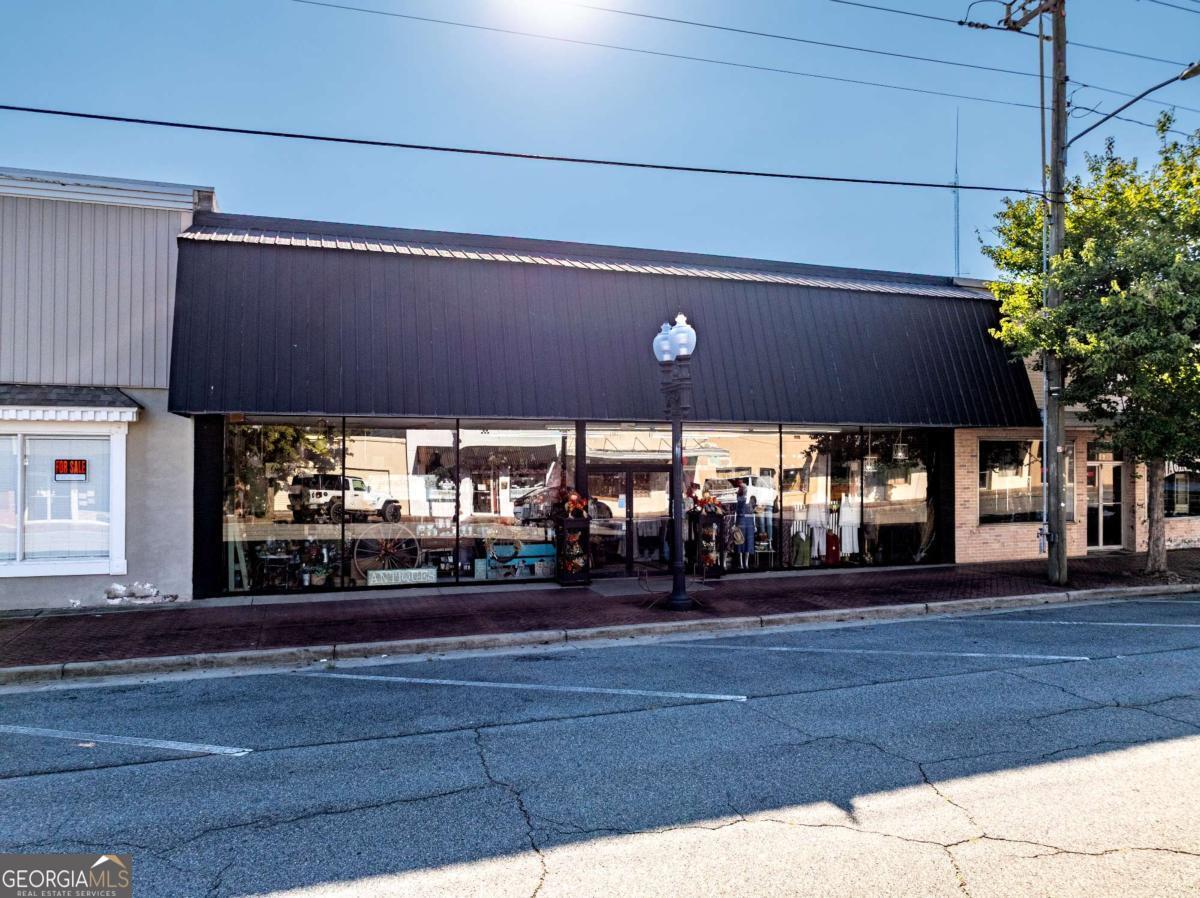 Don't miss this rare chance to own a thriving, fully operational boutique in the heart of Ashburn, GA. This property features a spacious 4,950 sq. ft. commercial building, originally built in 1964, and has been completely renovated with a new roof and modern updates. Currently operating as a stylish boutique, the sale includes all fixtures and approximately 90% of the inventory, making this a true turn-key investment. The store is still open and fully functional, with an established customer base and a reputation for quality. An added bonus is the plumbing already in place in the back of the building, offering the perfect setup for adding a caf or coffee shop-bringing even more potential to this versatile property. The current owner is moving on to a new chapter and is offering the property and business together but will also consider selling the storefront building only. Whether you're looking to step into the boutique business with everything ready to go or building only.