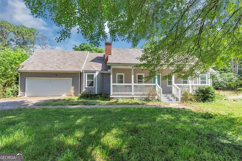MOTIVATED SELLER! WILL CONTRIBUTE WITH CLOSING COST. This 3 bedroom, 2 full bathrooms home is located on a spacious .84-acre lot and offers great potential. The main-level primary suite provides convenient living, while the upstairs features two additional bedrooms with their own loft/bonus rooms area; Ideal for a home office, playroom, or extra storage. While the home is ready for your personal touch with some cosmetic updates, key improvements have already been made, including a new roof (2020) and a new water heater (2021), providing peace of mind for future owners. HVAC on second floor to be replaced before closing. Enjoy the expansive yard, perfect for outdoor projects or relaxation. Sold as is. Conveniently located near Stone Mountain Park, shopping, and highways.