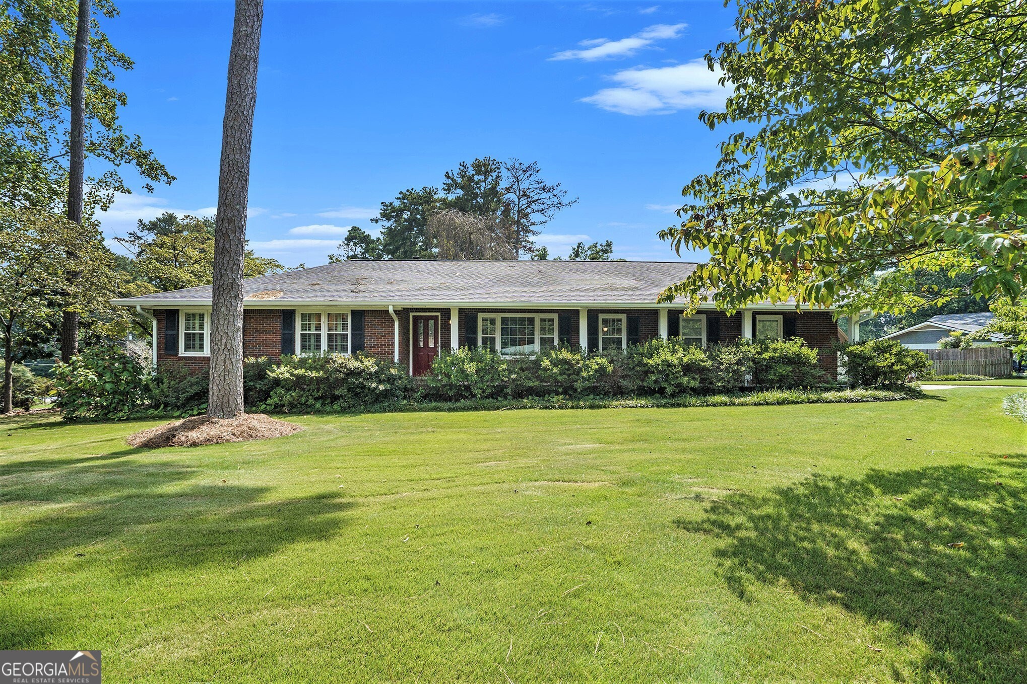 Welcome Home to this Stylish Brick Ranch with Basement Flex Space in the Heart of East Cobb! Nestled in the Highly Sought-After Stratford Community, this residence offers the Ideal Combination of Modern Comfort and Timeless Charm. Surrounded by Mature Trees and a Friendly Swim & Tennis Neighborhood, you'll find yourself perfectly positioned between Convenience and Community. The curb appeal abounds with a Corner Lot, large Flat Grassy Front Yard, and lovely landscaping. Head inside to the Formal Living Room that can serve as a versatile Flex Space, highlighted by Big Windows with Custom Wooden Shutters, Hardwood Floors, and Glass French Doors opening to the Formal Dining Room. Perfect for Entertaining and Making Memories. The Dining Room flows into the Kitchen featuring White Cabinets, and Stainless Steel Appliances. The Fireside Living Room boasts a door to the Private Large Deck an ideal spot for Al Fresco Dining overlooking the Massive Backyard. The Primary Bedroom on Main includes an Ensuite Bathroom with Shower, while Two Additional Bedrooms share a Hall Full Bathroom. The Daylight Basement is a True Gem perfect for a Playroom, Home Office, Gym, or Media Space. Step outside to the Private Fenced Backyard with Deck and Storage Shed. With plenty of space for Play, Gardening, or Weekend Grilling, it's designed for everyday living. A Two-Car Garage adds Extra Storage and Convenience. Living in Stratford means more than just a home it's a Lifestyle. Enjoy Optional Swim & Tennis Amenities, plus nearby Terrell Mill Park with Playground, Sports Fields, Pickleball, and Tennis Courts. With Quick Access to I-75, I-285, Sandy Springs, and Downtown Atlanta, you're connected to everything while enjoying the serenity of East Cobb living. Enjoy the Space, Flexibility, and Sense of Community Stratford is Known For. This East Cobb Ranch is Ready to Welcome You Home!