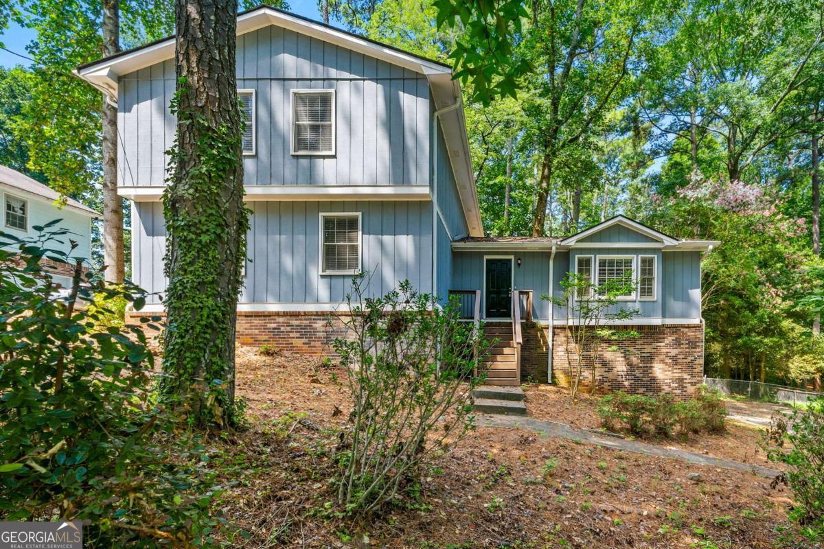 Welcome home to 215 Hauteur Pl SW in desirable Lilburn, GA! This spacious 4 bedroom, 2.5 bathroom home offers comfort and convenience in a great location. You'll love the long driveway with ample parking and the modern kitchen featuring stainless steel appliances. Cozy up by one of two fireplaces - found in both the living room and family room. The large fenced backyard provides the perfect space for pets and entertaining, while the relaxing deck offers an ideal spot for outdoor enjoyment. With its functional layout and appealing amenities, this home provides the ideal setting for both everyday living and hosting gatherings with family and friends. The fenced yard offers privacy and security, while the deck creates a great space for grilling or simply unwinding after a long day. Located in a quiet neighborhood yet close to shopping, dining and major roads, 215 Hauteur Pl SW combines suburban tranquility with urban convenience. Don't miss this opportunity to make this lovely property your new home sweet home!
