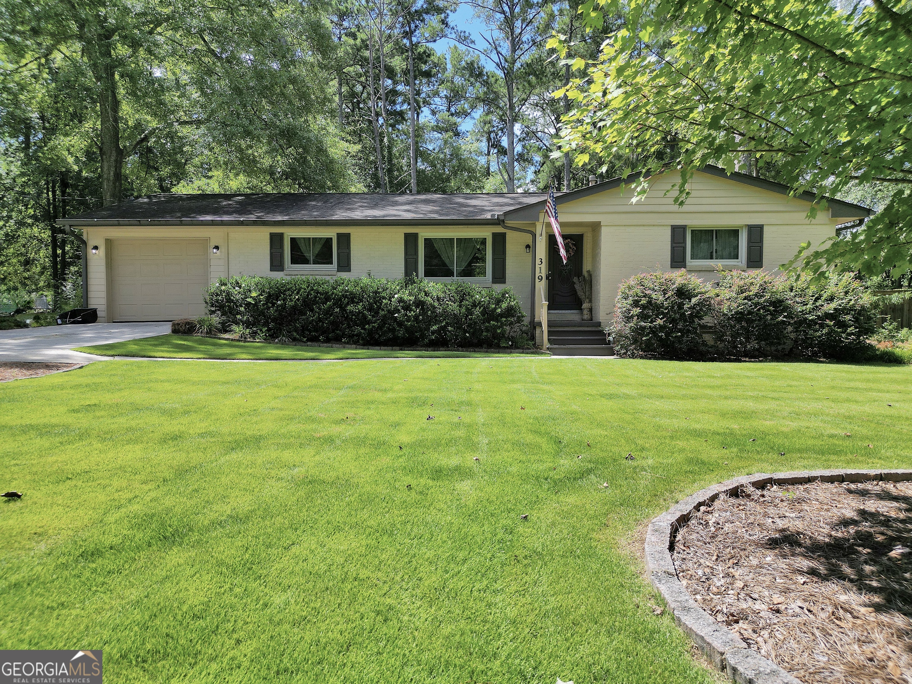 This beautifully updated home in historic Oxford offers the perfect combination of privacy, comfort, and convenience. Located less than 5 minutes from I-20, shopping and dining. It also sits within walking distance to Oxford College of Emory University, its walking trail, and Asbury Park playground. Covington Square and the Georgia International Horse Park are just a 10-minute drive away. Inside, you'll find a bright, open floor plan featuring a completely renovated kitchen with granite countertops, classic subway tile backsplash, and all-new stainless steel appliances. The spacious living room and all three bedrooms boast rich hardwood floors throughout. Step outside to your own private oasis-complete with an in-ground saltwater pool, expansive back deck, and a fully fenced yard bordered by mature trees for added privacy. This outdoor space offers total privacy and is perfect for relaxing, entertaining, or cooling off on hot Georgia days. Additional features include an attached shed, laundry area, and ample storage space.