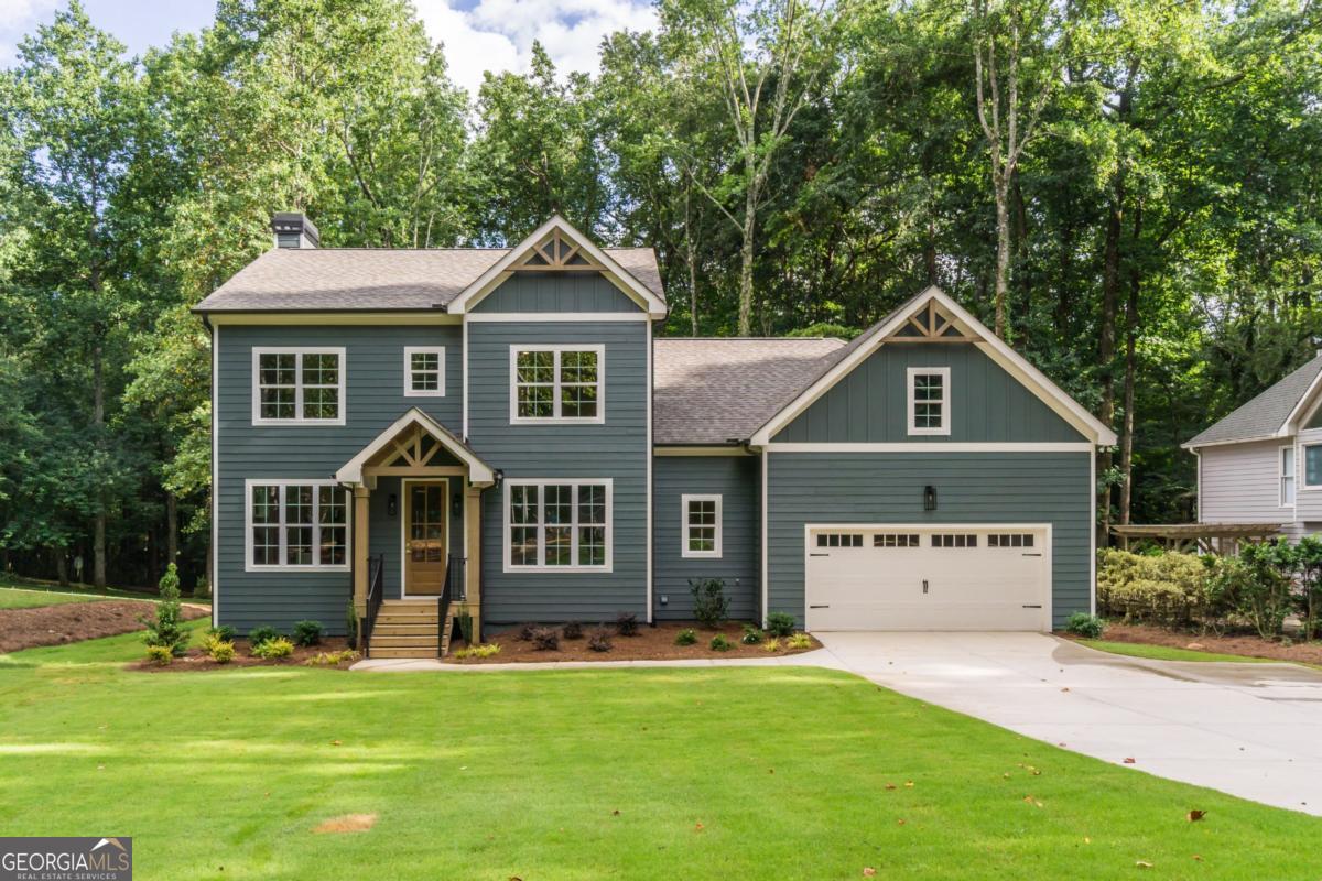 Stunning New Construction Modern Farmhouse on .59 Acres - No HOA! On Sewer! Experience the perfect blend of contemporary design and timeless charm in this beautifully crafted Modern Farmhouse, nestled on a spacious .59-acre lot with no HOA restrictions. This brand-new home offers the ideal balance of luxury, comfort, and functionality in a peaceful yet convenient location. Step inside to a light-filled open floor plan that effortlessly connects the living area with a chef-inspired kitchen, designed for both entertaining and everyday living. The kitchen features high-end appliances, an oversized walk-in pantry with stained wood countertops, and abundant cabinetry for all your storage needs. The primary suite is conveniently located on the main level, boasting a spa-like en-suite bathroom and an expansive, custom-designed walk-in closet. Upstairs, you'll find three generously sized bedrooms, two full bathrooms, and a versatile bonus room-perfect for a home office, media room, or play area. Enjoy serene views from the covered back deck, an ideal spot for relaxing evenings or outdoor gatherings. The full daylight walkout basement is ready to be finished to your specifications, with plumbing already stubbed for a future bathroom. Plus, a massive walk-in attic offers even more space for storage. Located in a top-rated school district, this home is perfect for families seeking both style and substance. With modern finishes, thoughtful design, and a tranquil setting, this dream home has it all. Also only half a mile from the brand new Publix at Hwy 20 and Post Rd! Schedule your private tour today and make this extraordinary home yours!