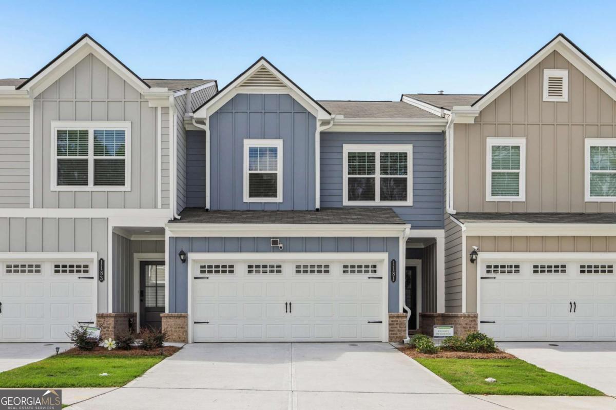 Listed by Mano Sells Homes: Live stylishly and comfortably in this gorgeous NW orientation townhouse nestled in the sought-after Ellison Square community of Sugar Hill, GA. Bursting with natural light and thoughtfully designed, this home proves you can have both space and style. The open-concept floor plan delivers effortless flow, with upgraded vinyl plank flooring stretching across the main level. The kitchen is a showstopper-granite countertops, modern stainless steel appliances, and beautiful cabinetry combine for a space that's as functional as it is beautiful. Upstairs, you'll find generously sized bedrooms, including a serene primary suite with a spa-like bath featuring a large walk-in shower, double vanity, and a linen closet for added convenience. Nine-foot ceilings on both levels enhance the spacious feel throughout. Enjoy your morning coffee or evening unwind on the covered rear patio, and leave the lawn maintenance to the HOA-it's covered! Just minutes from Downtown Sugar Hill and Lake Lanier! Close to shopping, top-rated schools, and scenic trails, this one checks every box. Don't miss your chance to live in one of Sugar Hill's most convenient and charming communities!