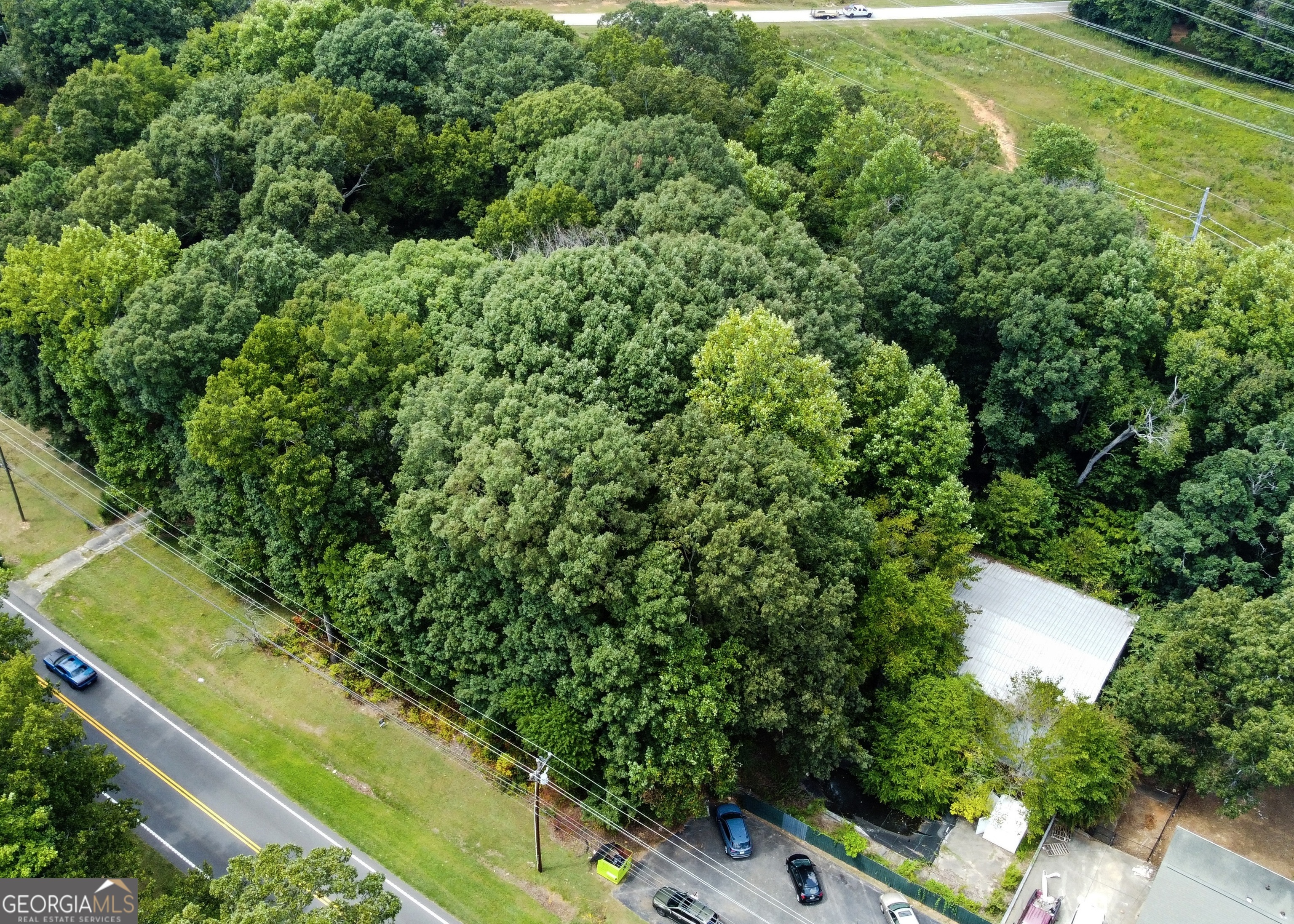 .50 acre available as a development opportunity in Douglasville, only 9 minutes from Sam's Club and shopping! Zoned C-G (Commercial General) Could be downzoned with approval to residential for a home.