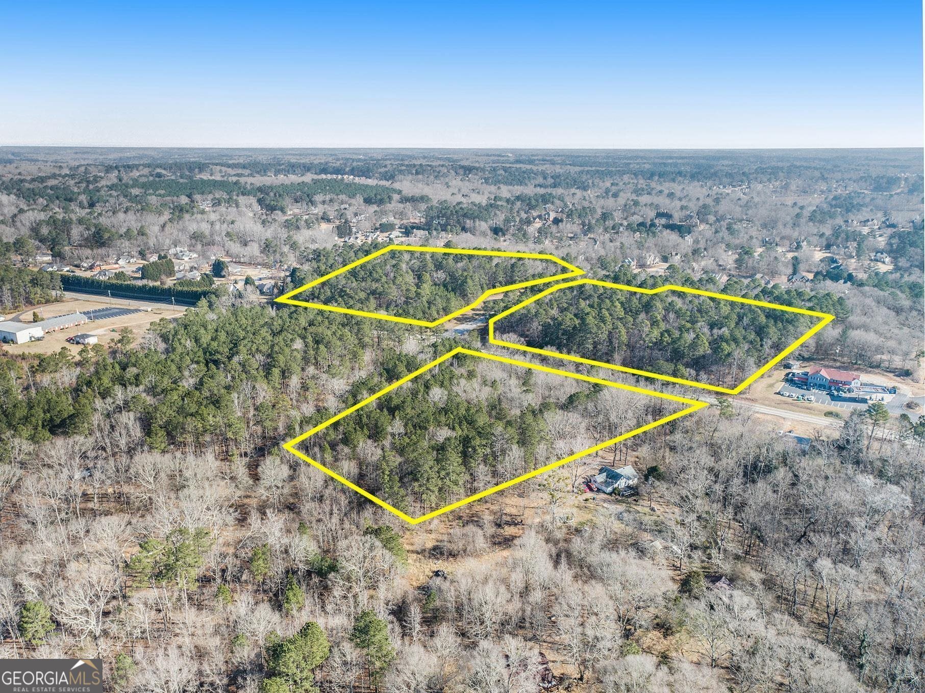 Calling all builders/developers! 4.66 acres on Hwy 42 in McDonough. Great for commercial or residential use. Only two miles to McDonough Square! Also have two parcels across the street listed separately: 090-01027002 & 090-01027003.