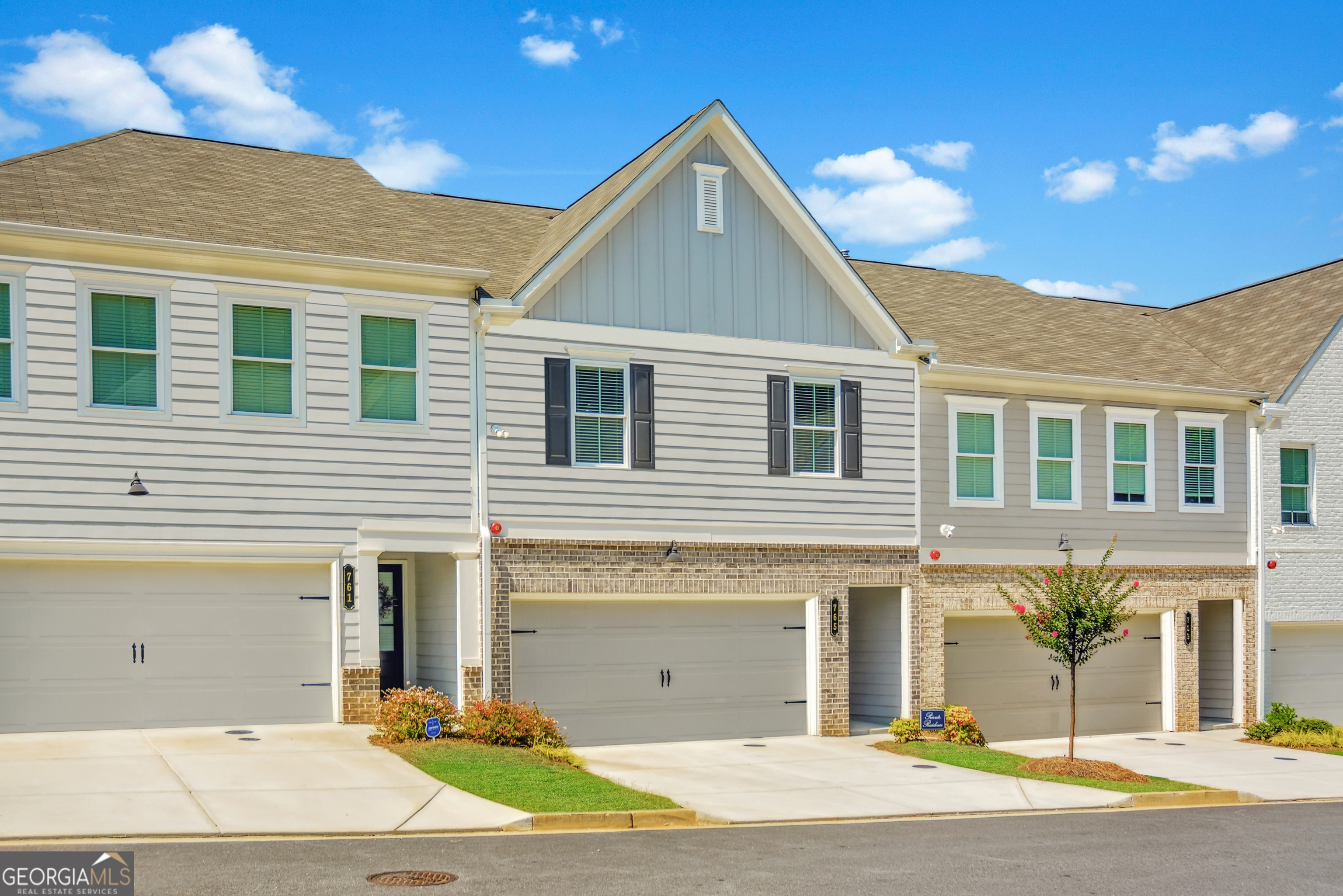 MODERN LUXURY MEETS CONVENIENCE IN THE HEART OF MARIETTA + 100% FINANCING OPPORTUNITY ON THIS NEARLY NEW, MOVE-IN READY TOWNHOME!!! Ask about PATH loan eligibility, offering $0 down and no PMI for qualified buyers! This beautifully upgraded Traton Homes "Brooks B" floor plan sits in the boutique Gates at Hamilton Grove community - just 1.5 miles from Kennesaw Mountain and minutes to the Marietta Square, Kennestone Hospital, Barrett Parkway, and major commuter routes. Built in late 2023, this 3-bed / 2.5-bath townhome offers over 1,800 square feet of thoughtfully designed space with custom touches throughout. The open-concept main level features durable LVP flooring, a cozy gas fireplace, and a designer kitchen with white cabinetry, quartz countertops, stainless appliances, pendant lighting, and a large island perfect for entertaining. Enjoy meals in the dedicated dining area or relax on the extended private patio - ideal for grilling or your four-legged friends. (Yes, fencing is allowed!) Upstairs, find a generous loft flex space, a spacious primary suite with a walk-in closet and spa-like bathroom, plus two additional spacious bedrooms and a full bath. Recent upgrades include stylish lighting, custom paint + wallpaper, and decorative wall trim. Neighborhood amenities include a pool, playground, fire pit, and green space. Whether you're a first-time buyer or looking for turnkey luxury in a thriving Cobb County location, this one checks every box. Motivated sellers - don't miss your chance!
