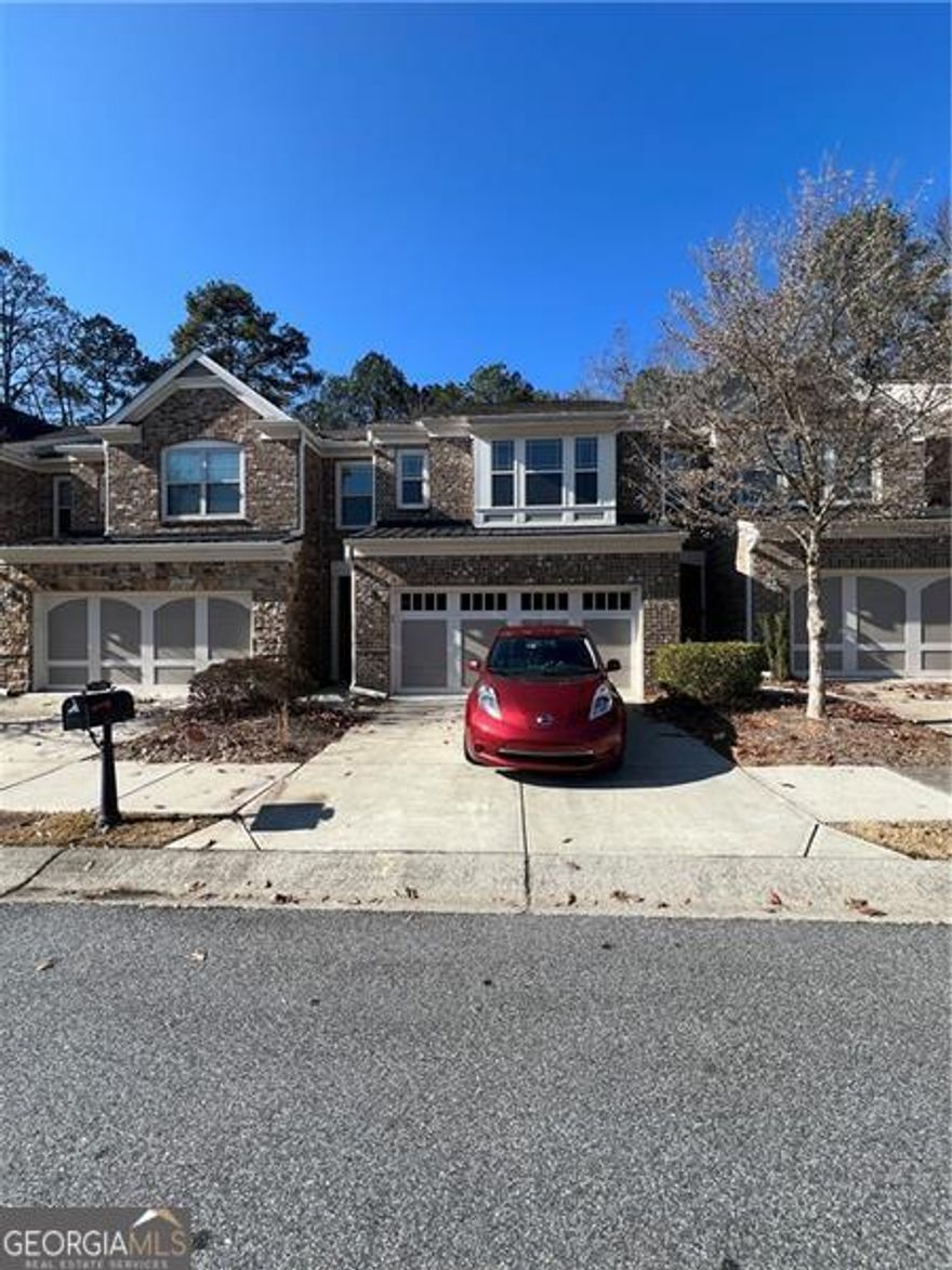 Location, Location, Location!  Welcome home to this fabulous, better-than-new, luxurious 4-bedroom, 3-bath townhome in the gated swim community of Hidden Forest. Nestled in a family-friendly community with top-rated schools (Alpharetta HS), this serene oasis offers a perfect blend of modern living and convenience. Located just moments from GA 400, Avalon, and Halcyon, you'll enjoy easy access to shopping, dining, and entertainment while being surrounded by lush greenery in the heart of Milton and Alpharetta.  This bright and beautifully maintained home features an open floor plan with dark hardwood floors throughout the main level and an elegant staircase adorned with wrought-iron balusters. The gourmet kitchen boasts top-of-the-line stainless steel appliances, a large island, breakfast bar, dark cabinetry, luxurious granite countertops, and a tiled backsplash. The huge kitchen flows seamlessly into the fireside family room and dining area, illuminated by a wall of windows. A glass door leads to the rear deck, offering the perfect spot to relax.  A guest bedroom and full bathroom are conveniently located on the main level perfect for guests, in-laws or parents. Upstairs, the enormous owners suite impresses with a sitting area, large windows, and a spa-like bathroom featuring a garden tub, a separate glass shower, dual vanities, and a spacious walk-in closet. Two additional bedrooms, an updated full bathroom, and a laundry room complete the upper level.  This home has granite countertops, stainless steel appliances, and tiled bathroom floors. The gated community offers fantastic amenities, including a swimming pool and a dog park.  Don't miss your chance to RENT this secluded gem.