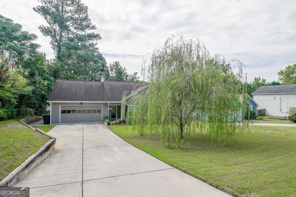 Photo of 690 Springlake Rd, Lawrenceville, GA 30045 (MLS # 10663285)