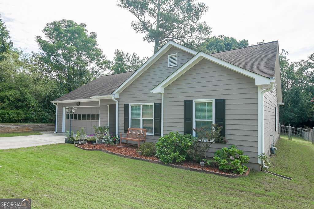 Photo of 690 Springlake Rd, Lawrenceville, GA 30045 (MLS # 10663285)