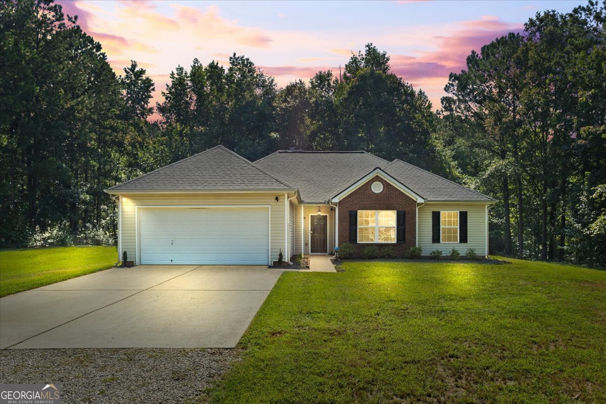 Great, updated ranch home for sale in McDonough. New laminate hardwood flooring throughout interior of home. Formal dining room. Family room with wood-burning fireplace and high ceiling. Kitchen with dishwasher, range/oven, refrigerator, pantry and breakfast area. Separate laundry room. Large primary bedroom with office/sitting area. Primary bathroom with double vanity, separate tub/shower and walk-in closet. New roof in December of 2024. Low maintenance vinyl siding exterior. 2-car attached garage. 1.279 acre private lot. Storage shed in back yard. No HOA! Schedule your showing today!