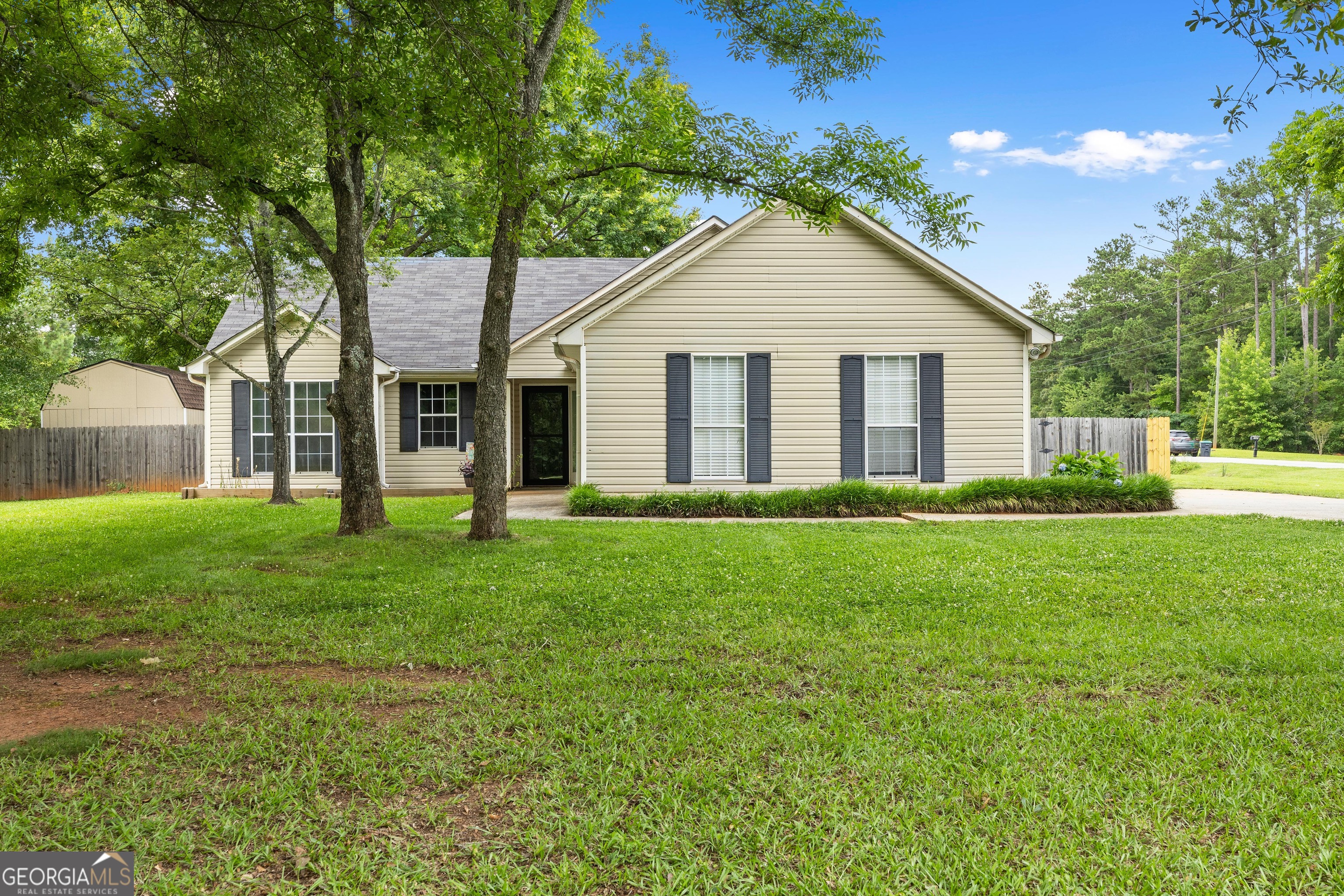 Just what you have been waiting for... Great ranch home on a large open lot with a 2 car garage and a fenced backyard! Great split bedroom floor plan. You will love the privacy this backyard offers - Check out the fire pit and outbuilding! Beautiful setting just waiting for you to come HOME! Situated in the middle of McDonough & Locust Grove for super convenience to both cities and I-75! Call Jamie to schedule your showing today! Seller offering to help with CC, FHA appraisal acquired, Clear Termite/Septic Letter. Ready to go!