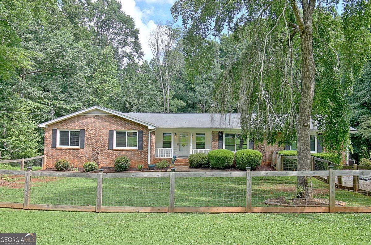 ***BRAND NEW ROOF ON THIS BEAUTIFULLY MAINTAINED FULL BRICK RANCH ON AN UNFINISHED DAYLIGHT BASEMENT!*** This home truly checks all of the boxes! Situated on a private, lush, one acre lot in charming Chanticleer, this three bedroom, two bath home offers convenience and so much flexible space! You will step into a welcoming living room that leads to a delightful sunroom and back deck, overlooking the gorgeous back yard! Adjacent to the living room, enjoy an inviting eat-in kitchen and generous laundry space. A separate dining room doubles as a perfect office! Three large bedrooms offer plenty of space for family and friends, and an unfinished basement provides potential expansion options or an ideal area for hobbies and storage. With new windows, a new HVAC and ductwork, and a fully encapsulated crawlspace and waterproofed basement, this home is truly move in ready with complete peace of mind.