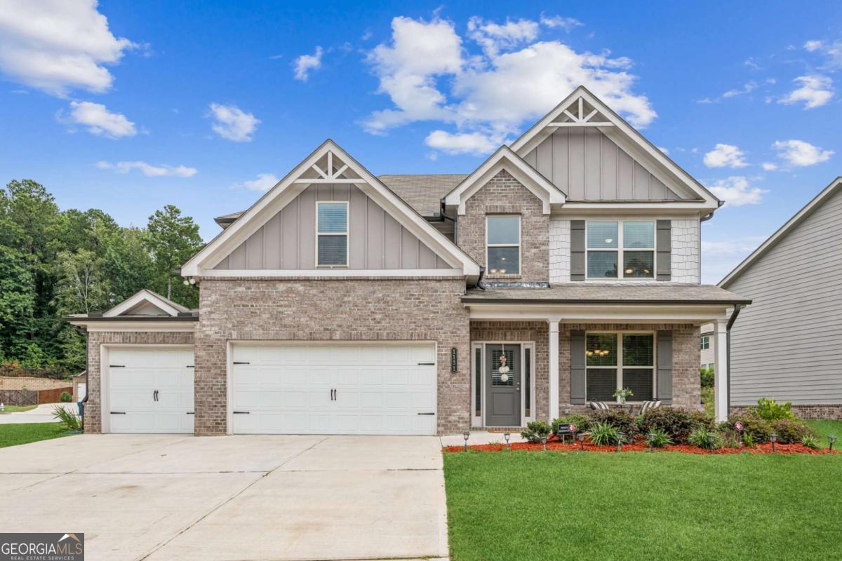 Welcome to this stunning 4-bedroom, 2.5-bath home that perfectly combines style and functionality. Located on a desirable corner lot with a brick and Shake-front exterior and a spacious 3-car garage, this home is just minutes from all the best that Lawrenceville has to offer. Step inside to discover LVP flooring flowing throughout most of the main level. A versatile dining or flex space greets you at the entrance, while a hallway leads to a convenient half bath before opening into the inviting main living area. The open floor plan features a cozy family room with a white fireplace flanked by two windows filling the space with natural light. and back stairs to access the upper level. Overlooking the family room, the beautifully appointed eat-in kitchen offers granite countertops, gray and white cabinetry, stainless steel appliances, a center island, and plenty of room for a breakfast table. A charming patio just off the kitchen makes outdoor dining or relaxing a breeze. Upstairs, the oversized primary suite is a true retreat, complete with two walk-in closets, dual vanities, and a spa-inspired bath with a soaking tub and separate shower. The laundry room is conveniently located just outside the primary suite, and three additional bedrooms share a full bath, offering plenty of space for family or guests.This hone is located in the Mountainview School district and offers easy access to I-85 and 316. It is located less than 10 minutes to the Gwinnett Stripers stadium, The Exchange, Mall of Georgia, and Downtown Lawrenceville, and less than 20 minutes to Chateau Elan and Lake Lanier. With simple elegance and tranquil living combined with Dining, Shopping, and Recreation, practically at your back door, you're not going to want to miss the opportunity to make this home your new reality!!