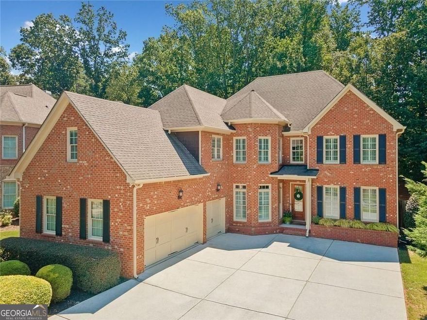 Welcome to 4550 Wigley Estates Road - a stylish executive home in East Cobb! This beautifully updated 3-sided brick residence offers the perfect blend of luxury, functionality, and location. Nestled on a private, flat, fully fenced lot with mature trees, this home features a 3-car garage and a spacious, thoughtfully designed floorplan ideal for modern living. Step inside to discover new LVP flooring throughout the main level, fresh neutral paint, and striking updated lighting fixtures. The home exudes contemporary elegance, with soaring ceilings and stylish finishes throughout. The powder bath has been fully remodeled and features a dramatic black Calacatta Monaco waterfall sink that makes a bold statement. The main level includes a dedicated office and a versatile guest suite with an ensuite bath - currently used as a home gym. Entertain effortlessly with a formal dining room, a spacious family room with an updated fireplace, an additional cozy sitting room, and a second updated fireplace for added charm. Culinary enthusiasts will appreciate the well-appointed kitchen, complete with stainless steel appliances, and ample cabinetry. Upstairs, retreat to the expansive primary suite with a serene sitting area, luxurious bathroom with his-and-hers vanities, a soaking tub, separate shower, and an impressively large walk-in closet. Two secondary bedrooms share a convenient Jack-and-Jill bath, while a third bedroom enjoys its own ensuite. A large bonus room completes the upper level - ideal as a media room or home theater. Located approximately a mile off Sandy Plains Road, this home is minutes from shopping, dining, and entertainment in both Downtown Woodstock and Downtown Roswell. Zoned for top-rated East Cobb schools, this property offers exceptional value and lifestyle in one the area's most sought-after communities. Stylish, spacious, and move-in ready, this one checks all the boxes. Come see it for yourself!