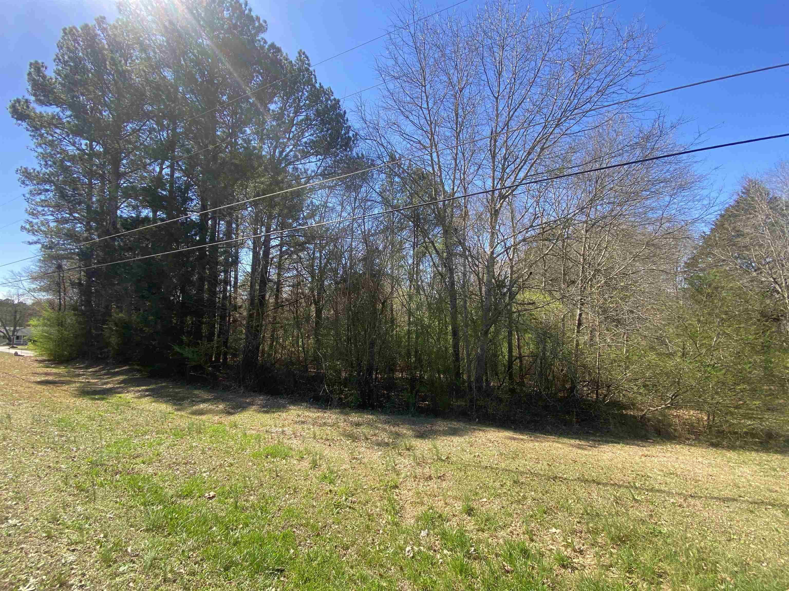 Bring your builder! 7.62+- acre undeveloped wooded property on Claude Brewer Road in Loganville. Zoned A-1. Perfect for a hobby farm, estate home, or large-lot homebuilding opportunity. Directly neighbors an additional 5.51 +- acres that MUST be a combined purchase due to road access (13.13 acres total, $385,000 total asking price). Image of adjacent parcel also attached. Location is convenient to Highway 81, 20, 78, and downtown Loganville. *Cross reference FMLS 7454668/GAMLS 10376791 for more information on second parcel.
