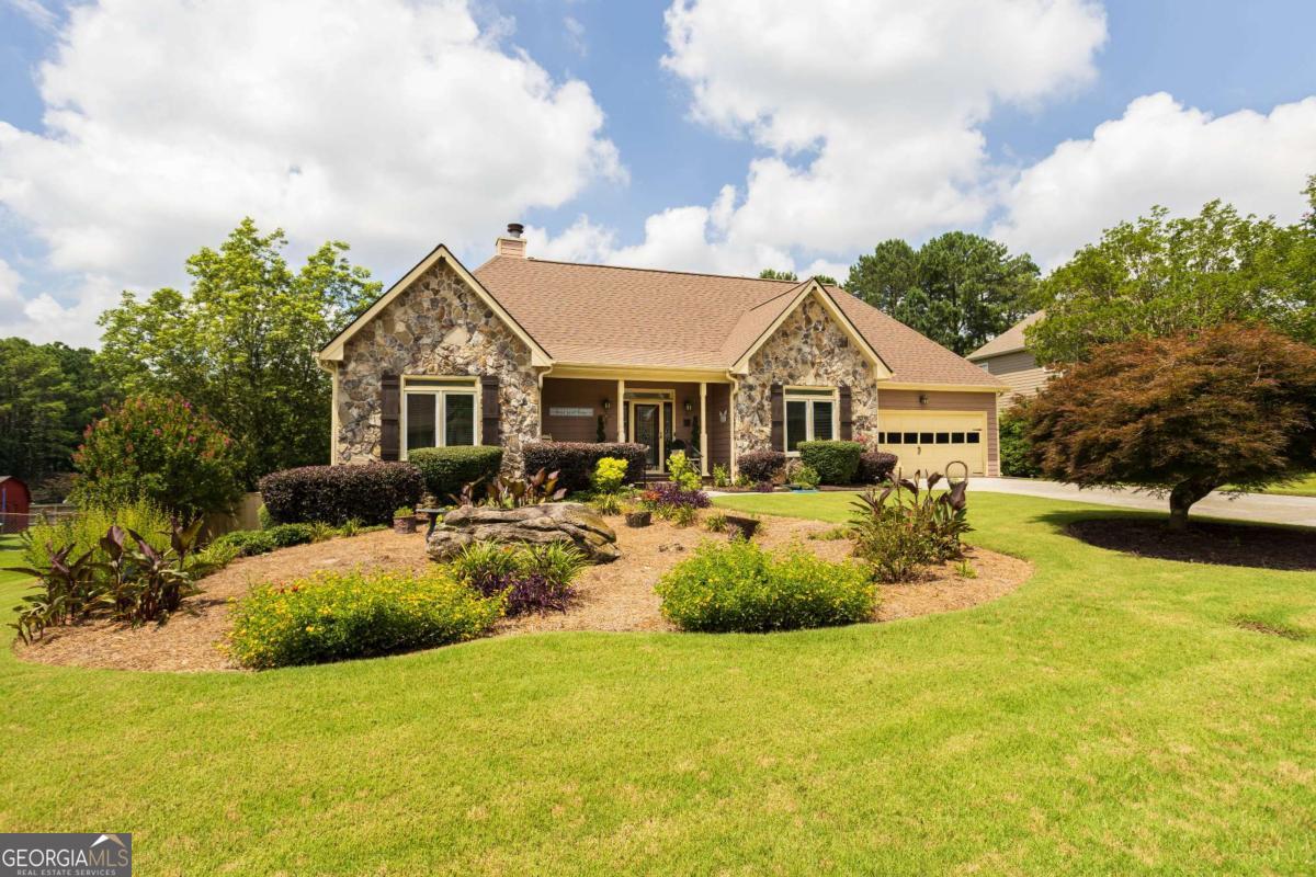 No HOA in Prime Loganville Location! HOME WARRANTY!! Well, maintain 4BD/3.5BA home. Master Suite on main w/ large spa bath. New roof, New Windows, New water heater, New Furnace~ Corian countertops in kitchen ~ Appliances two years old ~ Beautiful Land Scaped yard~ Incredible backyard with large, covered deck and hot tub! Finished basement. Must see!!! Appointment Only!! Listing agent is a co-owner of this property. Seller willing to contribute $1,500 towards carpet allowance with an accepted offer.