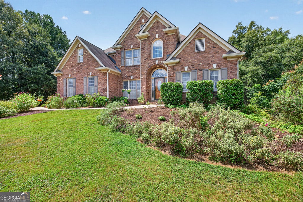 Photo of 2194 NE Indian Shoals Drive NE, Loganville, GA 30052 (MLS # 10836025)