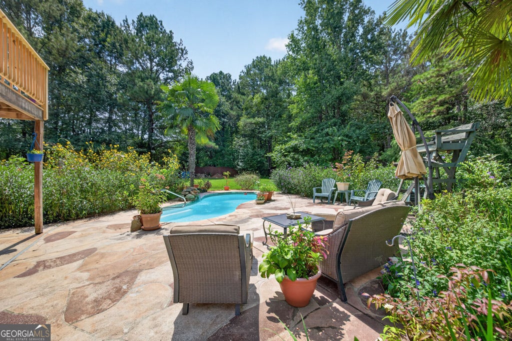 Photo of 2194 NE Indian Shoals Drive NE, Loganville, GA 30052 (MLS # 10836025)
