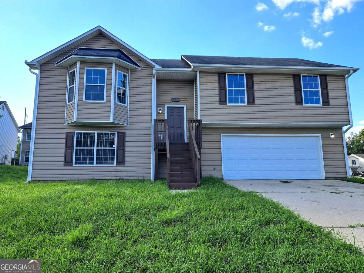 This is a very nice and spacious house with 5 bed rooms and 3 baths. Featuring a living area with large modern open concept with 15 ft high ceilings, a full size open kitchen with adjacent dining area, and a quiet porch in the back. Boasting a Great Master suite with private master bath. Huge 2 car garage with workshop/storage area. New paint throughout. New Carpet. New Commercial grade Luxury Vinyl Flooring. New Stainless Steel Appliances. Lots of space. Nice neighborhood. Only a few minutes to shopping, restaurants. Quick access to major express ways. Less than 15 mn to Airport. Agent is member of owning llc