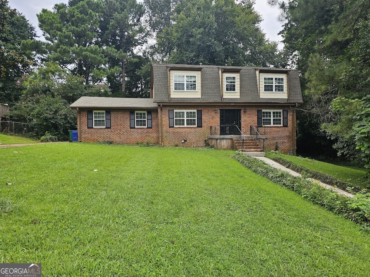 Spacious 4-bedroom, 2.5-bath all-brick home offering over 2,100 sq ft of living space. Inside you'll find a tiled kitchen, family room, and baths, along with an office, formal living and dining rooms, and a screened porch perfect for relaxing or entertaining. A rear-entry 2-car garage and partial unfinished basement with exterior access provide added functionality. Located in the Churchill Downs community, the home is close to schools, shopping, dining, and local parks. Easy access to major roads makes commuting simple, and you'll be just a short drive from downtown Decatur and approximately 20 minutes from the nearest beach access along the lakefront.