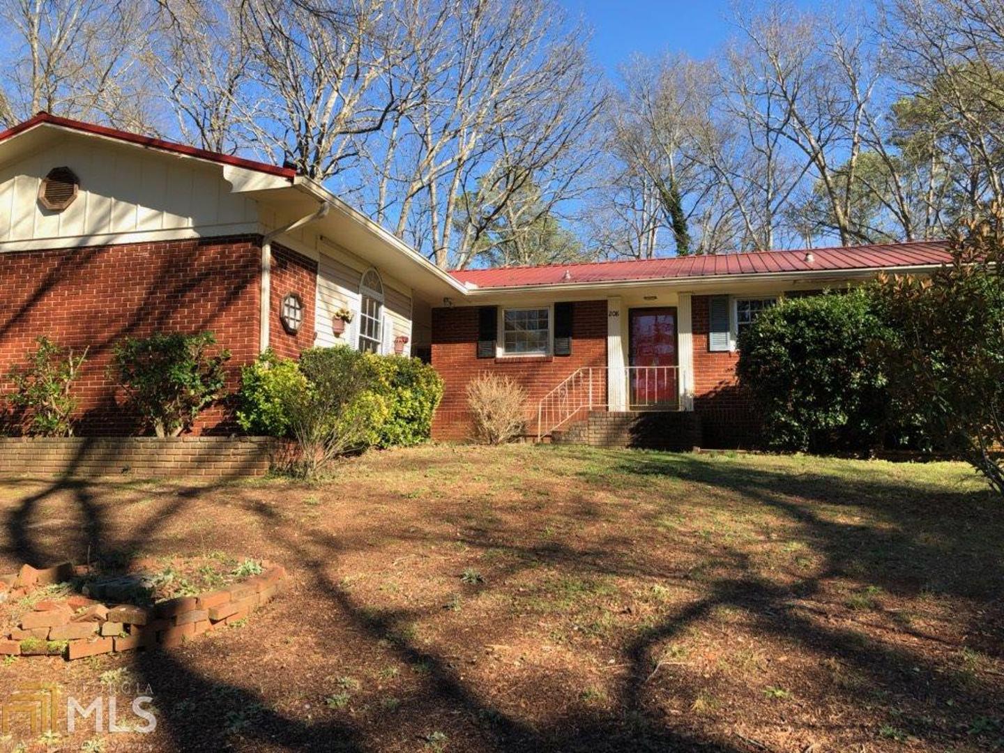 One level brick ranch in Sherwood Forest. Large greatroom with brick wall and fireplace. Hardwood flooring. Dining room, breakfast bar in kitchen (with appliances). Outdoor entertaining area needs TLC but great potential.