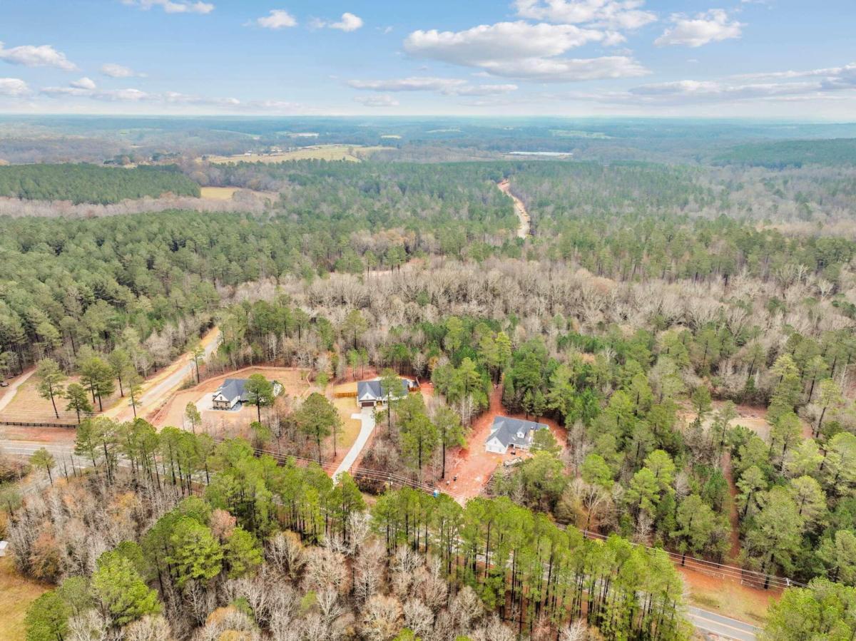 FINAL LOT AVAILABLE!!! Welcome to The Gates at Harmony Grove, one of Jackson County's most beautiful estate lot subdivisions. Located just minutes from Jefferson, Commerce, Athens, and Nicholson, this amazing piece of property will be sure to take your breath away. The community features 15 estate sized lots ranging from 8-16+ acres, as well as a private gated entrance, private gravel (soon to be paved) road, streetlights, and underground utilities. This lot is unique and features mature hardwoods, pines, and an abundance of wildlife. Protective covenants and HOA in place to share maintenance of the road, streetlights, and gated entry upkeep. Come build your dream home on the last remaining parcel in The Gates at Harmony Grove. Builder, Kingsworth Construction & Custom Homes. Don't know where to start? We have you covered from beginning to end and will make sure the process is easy and stress free. Don't miss this opportunity to secure your estate homesite in the Jackson County school district!