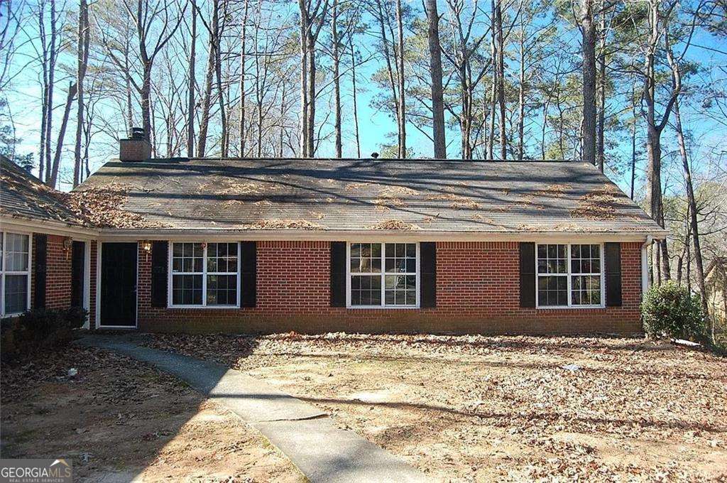 This three bedroom two full bath ranch style brick home is a rare find this close to downtown Woodstock with easy access to I-575. A generous kitchen with all white appliances and a breakfast nook, laundry room and sliding door to the patio. Large unfenced backyard with a storage building included.