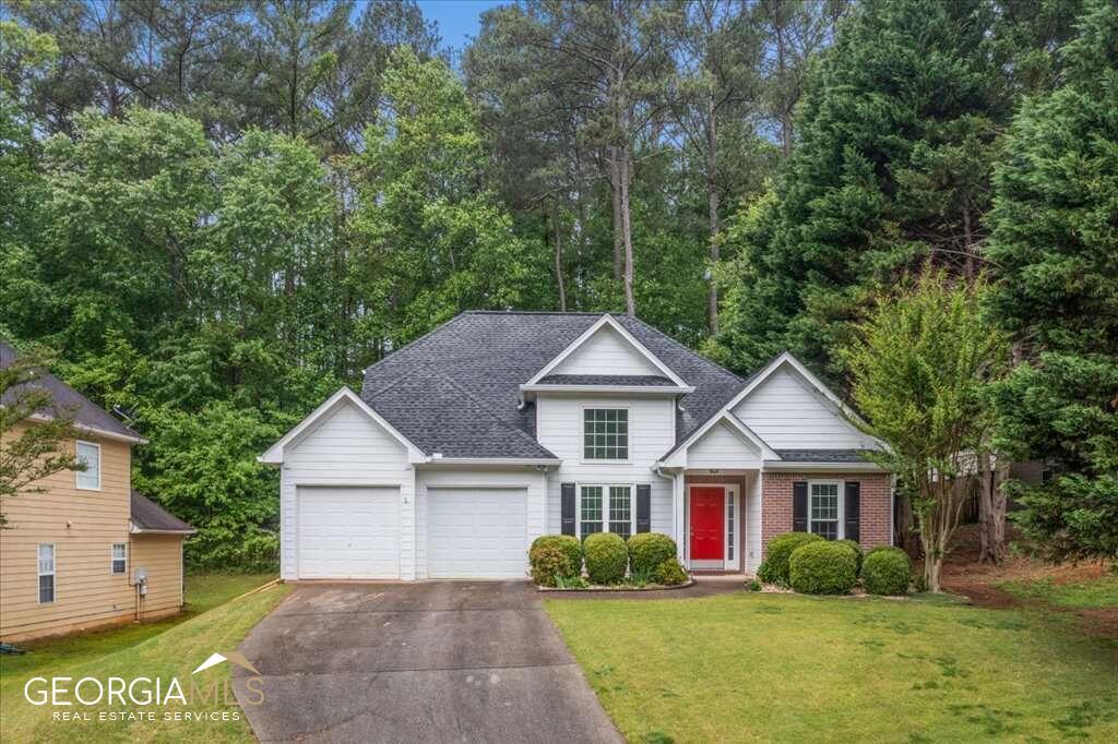 Welcome to this stunning 3-bedroom, 2.5-bathroom home located in the highly sought-after Kennesaw area, just footsteps away from top-rated Cobb County schools, shopping centers and recreation, including the popular Swift Cantrell Park. As you enter the home, you'll be greeted by a light-filled main floor that features a split bedroom floorplan, perfect for privacy and relaxation. The expansive bathroom is perfectly situated between the bedrooms providing ample storage space for sharing. The two-story formal dining room adds elegance to the home, while the eat-in kitchen boasts stainless appliances (which will all remain with the property!), an abundance of cabinetry and a view to the family room, making it perfect for entertaining guests. Located on the second floor, the owner's suite features double trey ceilings, an oversized closet and an en suite bathroom with double vanities and separate tub and shower, making it a true oasis. You'll notice the absence of carpet throughout the main floor as you step outside to the paved and beautifully landscaped backyard with a custom retaining wall, ideal for hosting barbecues and parties. This well kept home not only features a newer architectural roof and water heater, but also brand new gutters. Don't miss your chance to own this turnkey home in a prime location. Contact the listing agent to schedule your showing today!