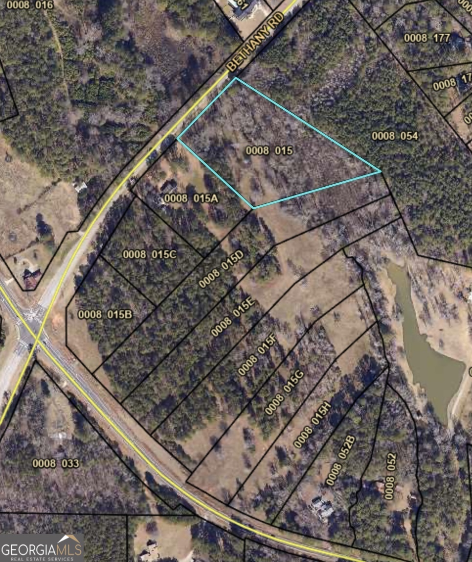 Build Now! This Premier Lot in Covington is Ready to Go! Are you ready for a ground-up build with no red tape, no HOA, and no waiting? This 5.396-acre lot is fully approved. Newton County has signed off on everything with permits, so there are no delays. Public water is available at the street, and the lot has passed a perc test for a standard septic system. Premium Lot 1 features road frontage, the freedom of no HOA, a scenic creek runs through the property, and the lot is marked for easy planning. With a countywide development approval ban in effect until August 19, 2026, this pre-approved parcel is a great opportunity in a locked-down market! USDA eligible.