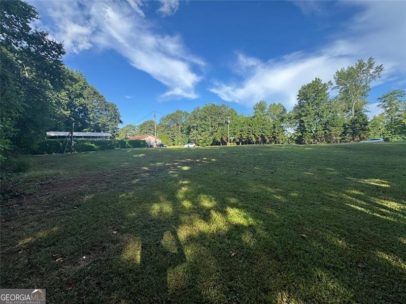 4159 Birch Bark Way, Douglasville, GA 30135 - Cleared Residential Lot, No HOA, Build your dream home or rental on this ready-to-go corner lot in a Douglasville. The lot is fully cleared with all utilities available-no timber, no prep work, and no HOA restrictions. Enjoy the quiet charm of a residential area with convenient access to shopping, great schools, and I-20. It's a perfect blend of privacy and accessibility, just far enough from the highway for peace and quiet, yet close enough for an easy commute. Whether you're looking to build a forever home or an income property, this lot offers great potential in a prime location. Secure your piece of the American Dream today!