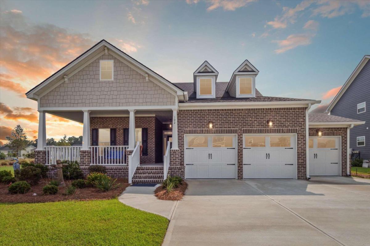 Gorgeous Low Country Home located on a Beautiful Lagoon in the heart of Pooler. The Expansive Front Porch allows for a Warm Welcome into this 4 Bedroom, 3 Full Bath and 1 Half Bath Home complete with Brick, Hardy Plank Exterior and 3 Car Garage. The Spacious Foyer opens to a Large Living Room - Open to the Gourmet Kitchen and Dining Area. Throughout the entire home, you will find Luxury Vinyl Plank Flooring and Ceramic Tile. Custom Built-Ins surround the Gas Fireplace in the Living Room and Crown Molding abounds throughout the entire home. The Gourmet Kitchen is complete with Corian Countertops, Center Island, Double Ovens, Gas Cooktop, Dishwasher and Refrigerator - all Stainless Steel. The Master Suite is located on the first floor and offers a Trey Ceiling, Double Vanities, Tile Shower and a Walk-In Closet. Custom Designer Accent Walls have been added throughout the home, along with a new Sunroom off the back that overlooks the Lagoon. This home is Picture Perfect and Will Not Last!