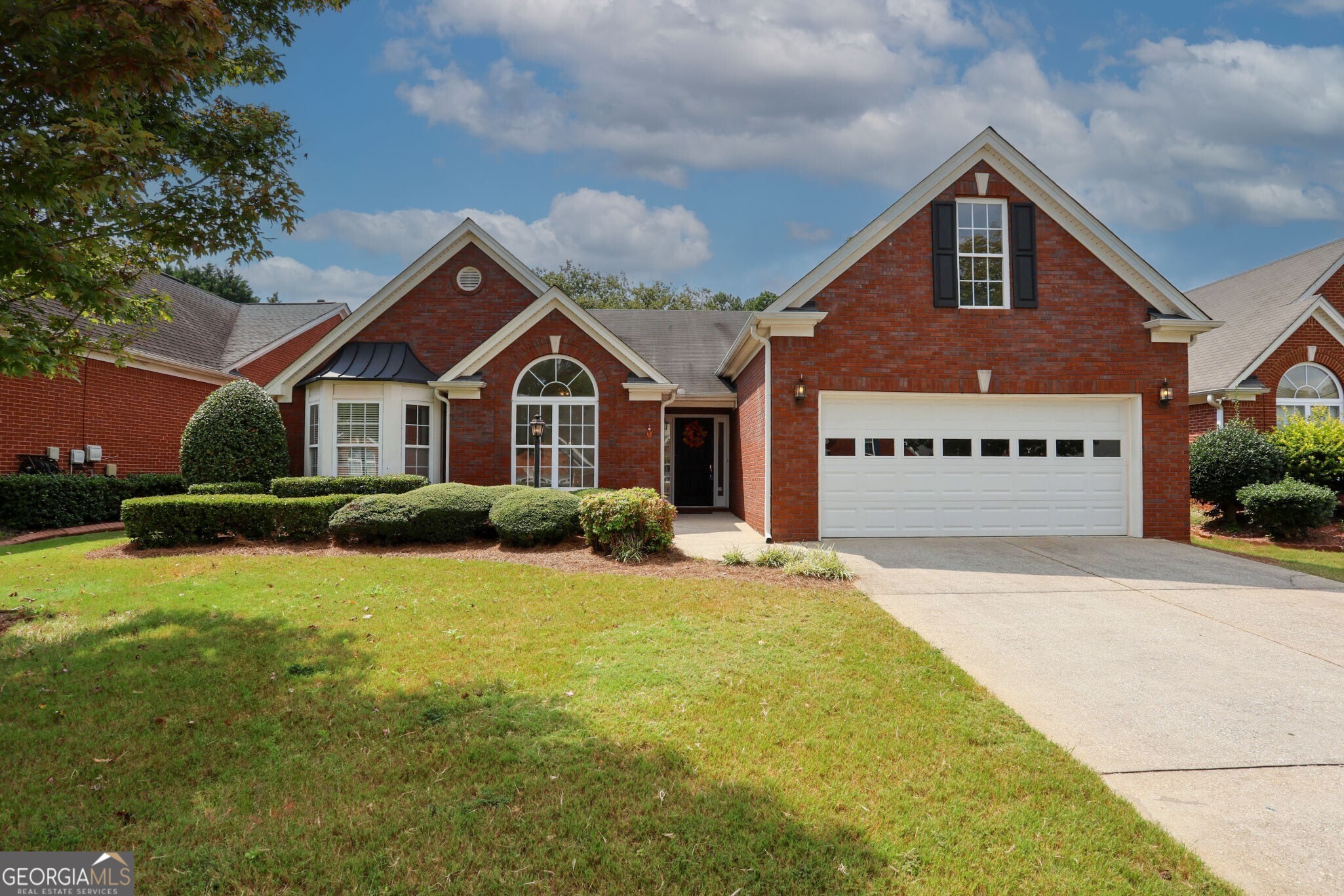 Welcome to this beautiful three bedroom, two bath all brick home offering the perfect blend of comfort and functionality. Designed with easy single-level living in mind, it also features a finished bonus room upstairs that's ideal for a home office, hobby room, guest retreat or storage. The foyer opens into the informal living area and flows seamlessly into the open-concept sunroom and informal dining areas. A cozy fireplace anchors the space, creating a warm and welcoming atmosphere. The large kitchen complete with a center island, provides plenty of room for cooking entertaining, and gathering with family and friends. Celebrate the holidays with plenty of room for the feasts in the adjoining formal dining room. The spacious primary suite provides a true retreat, with access to the attached primary bath with separate shower, soaking tub and double vanity. The primary suite also has an attached sitting room that could be used for an office or nursery! The home also features a light filled sunroom that's perfect for morning coffee or quiet reading, while the screened porch offers a comfortable space to enjoy fresh air and outdoor living without the bugs. Freshly painted in neutral tones throughout and new carpet, this home is move-in ready and designed for both style and comfort. This property truly checks all the boxes--single level living and timeless four side brick construction. Don't miss the opportunity to make this home your own--schedule your private showing today!