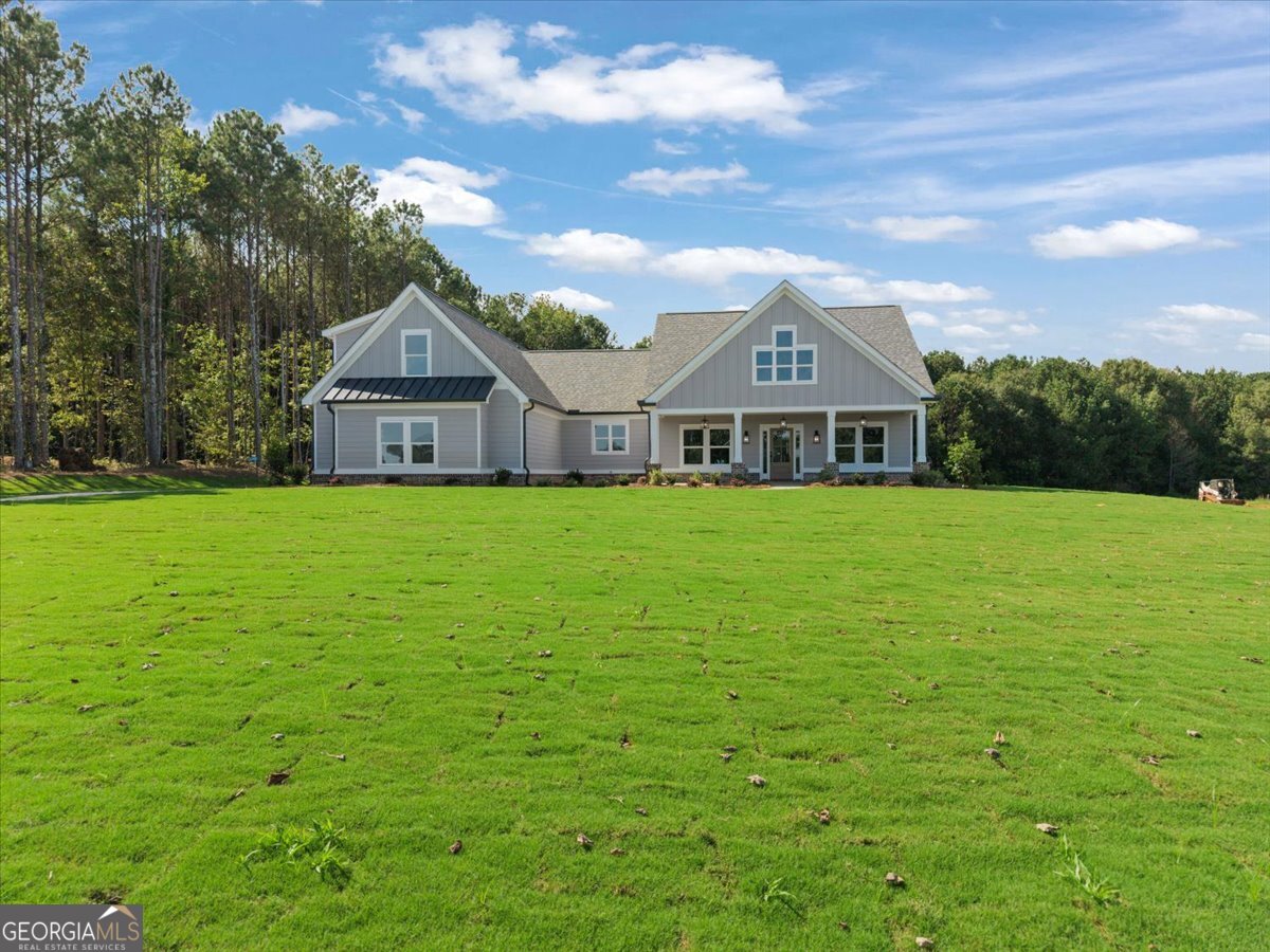 Let's get you into this home! **OUR BUILDER IS OFFERING UP TO $20,000 IN BUYER INCENTIVES ON ACCEPTED CONTRACT. Use it to buy down your interest rate or apply it toward your closing costs. Must be under contract by October 31, 2025 and finance with our preferred lender, Matt Black with Fairway Mortgage. Don't wait-this incentive won't last long! Call Matt today for details - (770) 262-8880.** From the moment you walk through the front door, you'll feel the warmth and charm that make this house truly feel like home. This 4 bedroom/3.5 bath home sits on 2.77 acres. This thoughtfully designed floor plan offers both style and functionality. The main level features a spacious family room with a cozy fireplace, separate dining room, and a charming breakfast nook accented with classic shiplap for added character. The kitchen is a cook's dream with a farmhouse sink, pot filler, stainless steel dishwasher, microwave and wall oven. It is beautifully appointed with elegant rose gold light fixtures and matching cabinet pulls that add a touch of luxury. Owner's Suite is on the main level and the bathroom is well appointed with both shower, soaking tub and separate vanities. You'll find two additional bedrooms, another bathroom and a half bathroom on the main floor, perfect for family or guests. The over-sized mudroom is beautifully designed with laundry folding station. Upstairs, a fourth bedroom and a full bathroom provide additional living space - ideal for a guest suite, home office, or playroom. Step outside to a large backyard with endless possibilities-add a swimming pool, start a garden, or simply enjoy the wide open space. Plus, there's an impressive 40x77 shed, perfect for storing equipment, recreational vehicles, or converting into a workshop or private retreat. Don't miss your chance to own this beautifully crafted home in one of Morgan County's most sought-after areas! Welcome to your dream home in Bishop, Georgia (Morgan County)! Conveniently located near Madison, Monroe, Watkinsville, and Athens. Agents please use the Contract Package found in the DocBox.