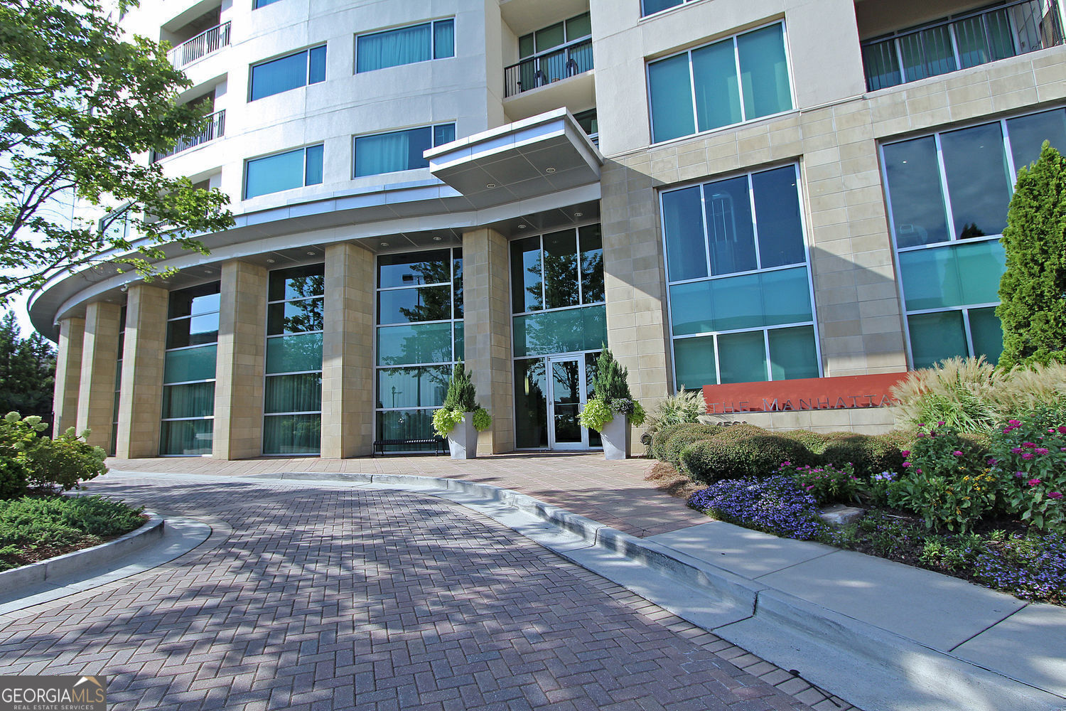 Introducing "The Astor" at The Manhattan Welcome to 4561 Olde Perimeter Way, Unit 608, in the heart of Dunwoody, GA. This beautifully maintained high-rise residence offers stylish urban living with a thoughtful layout and modern amenities. The open kitchen is a true centerpiece, featuring a spacious island with NEW stone countertops-perfect for meal prep, casual dining, or entertaining friends. The bedroom & closet flooring, plus the washer located in a separate laundry room, are all brand new. The water heater and toilet have been recently updated! The bright and inviting living area extends to a private balcony, where you can enjoy fresh air and city views. The generously sized bedroom features a walk-in closet, offering excellent storage space. Life at The Manhattan is all about comfort and convenience. Residents enjoy resort-style amenities including a sparkling pool, virtual golf simulator, tennis and pickleball courts, a dog walk, lush gardens with grilling areas, and beautifully designed gathering spaces. Built in 2006, this home offers both comfort and leisure in a prime location surrounded by premier shopping, dining, and easy transportation access. Whether you're looking for a vibrant community or a serene retreat, "The Astor" at The Manhattan is the perfect place to call home. This unit is move-in ready!