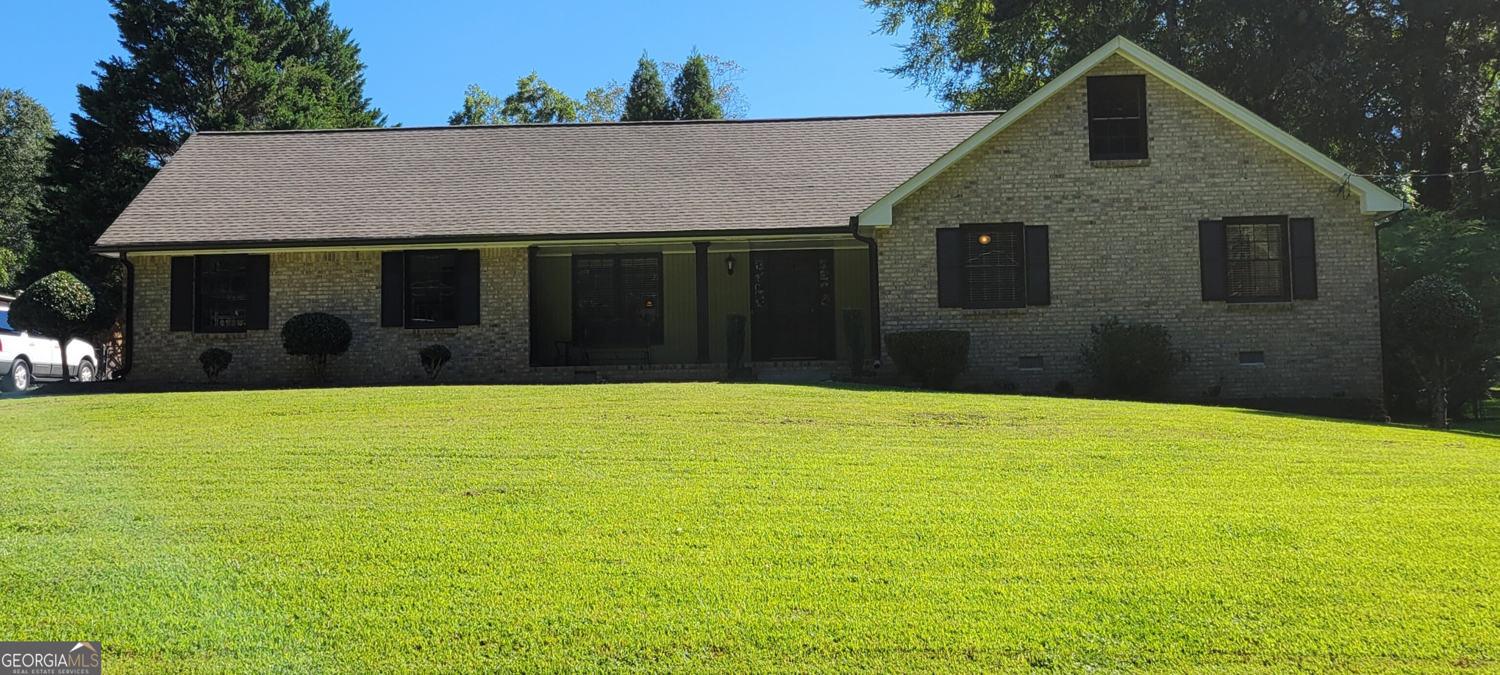 Lovely All Brick Ranch w/ In-Ground Pool, Well maintianed home with open floor plan, Large inviting Great Room w/ masonry fireplace, vaulted ceiling & hardwood floors opens to a Gentlemen's Study / possible Dining Rm. Double French doors lead to a sunny Formal Dining Rm or possible Sunroom with tiled floors and lots of windons. The Kitchen has stainless steel appliances, solid surface counter tops and hardwood flrs. A breakfast area w/ large window overlooks the back patio. Located in the Breakfast area there is an entry to a Mud room / Laundry rm and two car garage. A back stair case in the breakfast area leads to the upstairs Bonus Rm / 3rd Bedroom w/ possible walk-in closet or storage room. The Master bedroom opens to a newly renovated Master Bath w/ Jacuzzi tub, Tiled Floors, Double Vanity w/ solid surface counter tops, and Large Walk-In closet. A second full bath with Tub / Shower combo, single vanity and tiled floors connects to the Master Bath. There is also a second bedroom located on the main level. The Exterior of the home boost an In-Ground pool w/ side deck, back patio and storage building. This home is located in the Grayson school system.