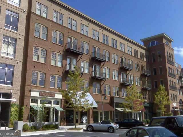 Stylish Downtown Woodstock Condo - Walkable Location with Peaceful Setting Welcome to your new home in the heart of Downtown Woodstock, where vibrant city living meets a quiet retreat. This beautifully designed 2-bedroom, 2-bath condo offers the perfect blend of convenience and comfort. Step inside to an open, spacious layout filled with natural light. The condo includes two dedicated parking spaces and a large private balcony on the back side of the building, providing a more peaceful and private place to relax after a long day. Enjoy all that the community has to offer, including a resort-style saltwater pool, private stage for concerts, a community park, and a playground. On weekends, take a short walk to explore Woodstock's charming shops, diverse restaurants, local coffee spots, and outdoor events, then return home to the comfort of your own quiet space. This home is ideal for those who want the energy of downtown living while still enjoying a calm and private place to recharge. Don't miss this opportunity to experience the best of both worlds in one of Woodstock's most desirable communities!