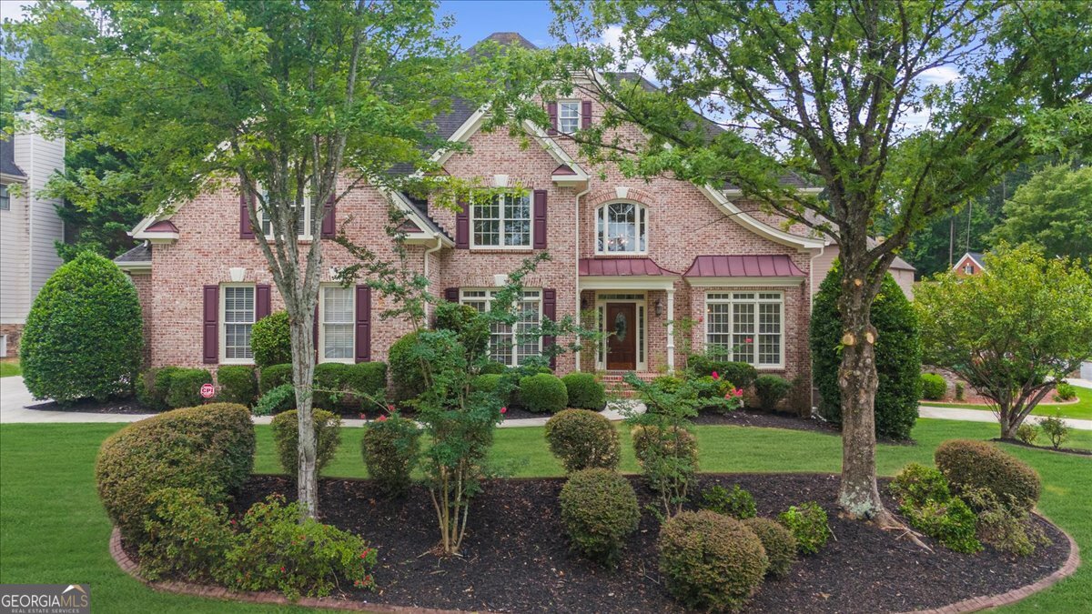 Welcome to 6031 Addington Dr., in the coveted Brookstone Country Club Community! This three-sided brick home is situated atop a beautiful pie-shaped homesite. Not only does it offer a 3-car side-entry garage, but there is an additional 4th car door located in the rear yard on the basement level--perfect for golf carts, ATVs, or a large workshop! This home offers newly finished REAL hardwood floors, brand new luxury carpet, and fresh paint throughout. You will be welcomed into the stunning two-story foyer showcasing brand new hardwood treads and wrought-iron railings on the stairwell. Main level includes private bedroom w/ ensuite bath, perfect for an in-law suite or even a main level office. The gorgeous kitchen includes white cabinets with a beautiful wooden vent hood, stunning quartz countertops, expansive island w/ wine cooler, pretty tile backsplash, walk-in pantry, and stainless appliances. The two-story great room is open and bright with built-in bookcases and beautiful hanging chandelier. The designated dining room is perfect for hosting large dinner parties. The front living room has so many possibilities, including a welcoming office area. Upstairs in the oversized owner's suite, you'll find your own sitting room with a cozy fireplace. The owner's bath includes a large double vanity with sitting area, separate tub/shower, and his/hers closets. One secondary bedroom offers an ensuite bath, while the other bedrooms are connected by a Jack and Jill bathroom. The basement includes a spacious entertainment room, brand new luxury vinyl plank flooring, full bath, potential gym, plenty of storage space, and the additional 4th car garage. The oversized deck is perfect for grilling out or entertaining outside. Top rated Schools of Pickett's Mill Elem./Durham Middle/Allatoona High. While Brookstone offers a clubhouse, swimming pool, playground, tennis/pickleball courts, basketball court, and play field, you also have the option of joining Brookstone Country Club. Brookstone Golf & Country Club offers an 18-hole Larry Nelson-designed golf course, full driving range, two chipping areas with practice bunker and large putting green, pro shop, and golf calendar events. For tennis or pickleball players, there are eight lighted tennis courts including two clay courts and 4 dedicated pickleball courts. Brookstone includes a Junior Olympic-size swimming pool and separate adult pool. Take advantage of the Members' grill for casual dining and full calendar of social events. The gym includes state-of-the-art strength and cardio equipment. Exercise classes encourage motivation through live, instructor-led classes room. Get a full-body workout as you enjoy your favorite fitness program, including yoga, Pilates, barre, and boot camp. This is a unique opportunity for a fully renovated home in a highly desirable community with top-rated schools--schedule your appointment today!