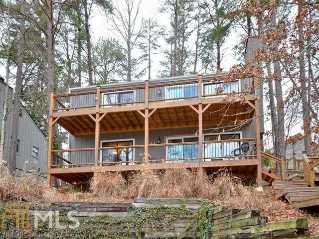 Enjoy relaxing days viewing the sparkling waters of Lake Arrowhead! Delightful LAKE view 4BD/3BA cottage! Fantastic double decks! Beautifully remodeled open & vaulted plan! Spectacular kitchen boasts Corian counters, gleaming stainless appliances (incl refrigerator & smooth cooktop), breakfast bar overlooking huge family rm w/stone fplc & wall of glass doors to sprawling deck w/views! Master & Guest suites on main! Terrace level suite offers massive rec rm/game rm/media rm w/wet bar, two bdrms, full bath! New Roof 2012; New exterior stairs 2013; New gutters! Furnished!