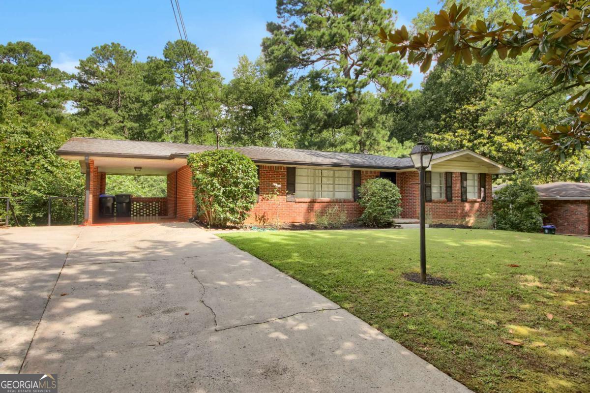 2 bedroom, 2.5 bath brick ranch with a partially finished daylight basement that includes a full bath. Quiet and private with a large fenced backyard overlooking a creek and surrounded by mature trees. The main floor gets great natural light and features neutral paint throughout. Includes a laundry room, carport, and a deck for enjoying the outdoors. Convenient to CDC, Emory, and I-85. Dogs are negotiable.