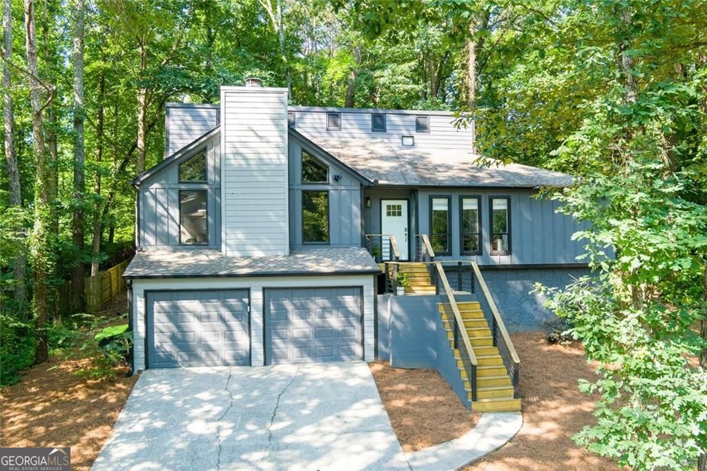 Stunning 5-Bedroom Home in Sought-After Holly Springs Crossings - East Cobb / Pope District Welcome to your dream home in the heart of East Cobb's desirable Holly Springs Crossings community, nestled within a quiet cul-de-sac and zoned for the award-winning Pope High School district. This beautifully updated 5-bedroom, 3-bathroom home offers 2,919 square feet of well-designed living space, perfect for both everyday comfort and entertaining. Step into the vaulted, oversized living room featuring a striking fireplace, creating a warm and inviting centerpiece. The newly remodeled open-concept kitchen is a chef's delight with white shaker cabinets, gleaming quartz countertops, and a spacious eat-in dining area-ideal for hosting family and friends. Just off the kitchen, step out onto the private grilling deck overlooking the peaceful backyard-perfect for weekend barbecues, morning coffee, or evening relaxation. The owner's suite offers a serene retreat, complete with a double-sink quartz vanity, a large walk-in closet, and updated finishes throughout. Upstairs includes two additional bedrooms and a fully renovated bathroom with modern touches. The daylight terrace level provides incredible versatility with a large bonus room, two bedrooms, a full bathroom, and additional flex space-perfect for a home office, gym, or storage. Sitting on a private lot, this home delivers privacy, charm, and convenience all in one. Don't miss this rare opportunity to live in one of East Cobb's most coveted neighborhoods!