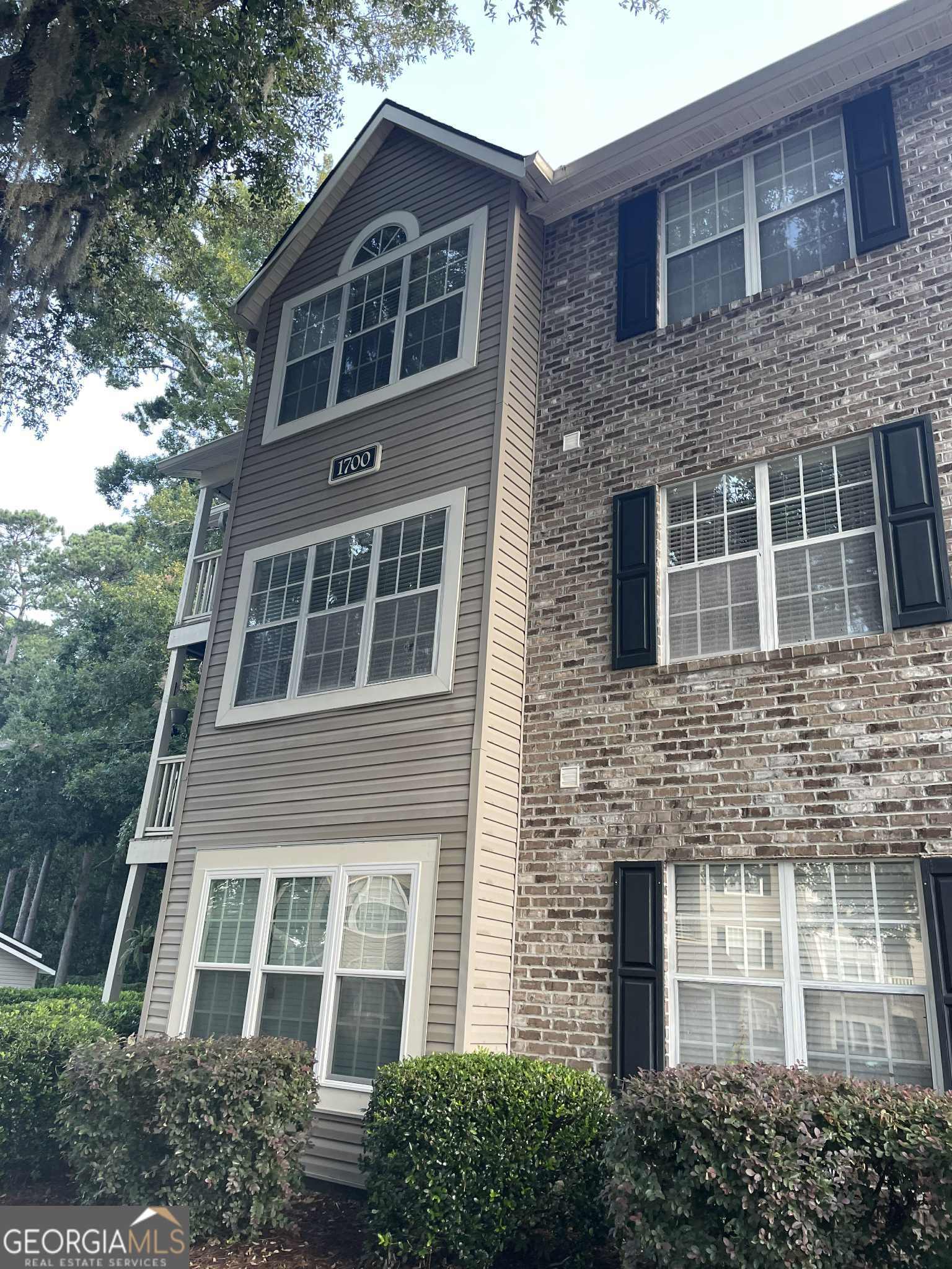 Welcome to coastal living at its finest. Hoover Creek Plantation is located close to the Georgia Southern's Armstrong Campus. This move in ready, one bedroom, one bath unit is located on the third floor with a balcony facing a wooded area. Open floorplan with an amazing sunroom that could be used as an office or dining area. Kitchen has a closet pantry and bar for entertaining guest as you cook. New HVAC (2025), newly painted rooms, and waterproof flooring throughout the unit. Kitchen appliances, washer and dryer included. Hoover Creek Plantation amenities include a pool, fitness center, kayak storage, community deep water dock on the river, boat and RV storage, picnic and dog walking park. COA fees include sewer, water, trash, landscaping, and postal services plus all community amenities. Seller is a licensed Georgia Real Estate Agent.