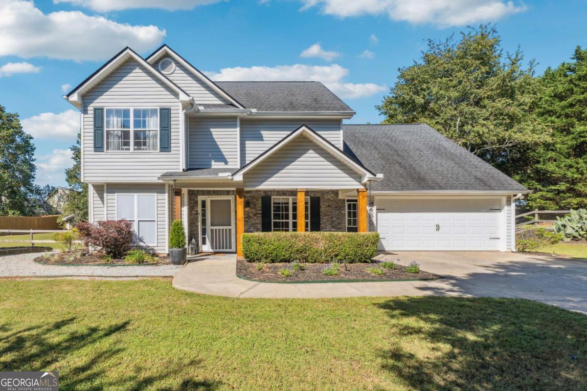 Welcome to this beautifully updated, move-in-ready 4-bedroom, 2.5-bathroom home that combines convenience with peaceful country charm. Located just minutes from Hwy 400, Lake Lanier, shopping, dining, and parks, this property offers the perfect blend of secluded living and everyday accessibility-with NO HOA restrictions! Step inside to a bright, welcoming entry that opens into a spacious living room with a cozy wood-burning fireplace. The open-concept layout flows seamlessly into the updated kitchen, featuring granite countertops, a stylish new tile backsplash, stainless steel appliances, and a timeless color palette. BRAND-NEW FLOORING has been installed throughout the main level, which also includes a sunroom, a versatile bonus room (perfect as a formal dining space or additional living area), a renovated half bath, and a dedicated laundry space. Upstairs, the oversized primary suite offers tray ceilings and windows overlooking the park-like backyard, a newly renovated spa-like bathroom with a frameless glass shower, and a large walk-in closet with custom storage. Three additional spacious bedrooms, a full bath and LOTS of storage complete the upper level. Outside, you'll find a huge, fully fenced yard ideal for both relaxation and entertaining. Enjoy raised garden beds, a smokehouse, an outdoor shower, and a deck prepped for a hot tub. The large patio is perfect for outdoor dining or gathering with friends and family. All appliances are included, and with a newer roof and water heater, this is truly a low-maintenance home ready for its next chapter. Located in the highly sought-after East Forsyth High School district, this home checks every box-no HOA, stress-free ownership, a private country feel, and unbeatable convenience. As an added bonus: Preferred lender is offering a FREE appraisal and 0.25% rate reduction! Don't miss your chance to own this turnkey gem-schedule your private showing today!